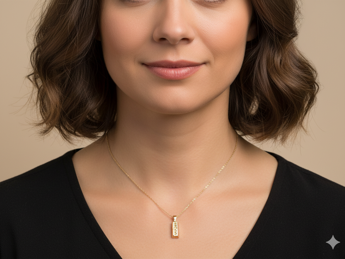 A 9 carat Yellow Gold Ingot Pendant & Chain