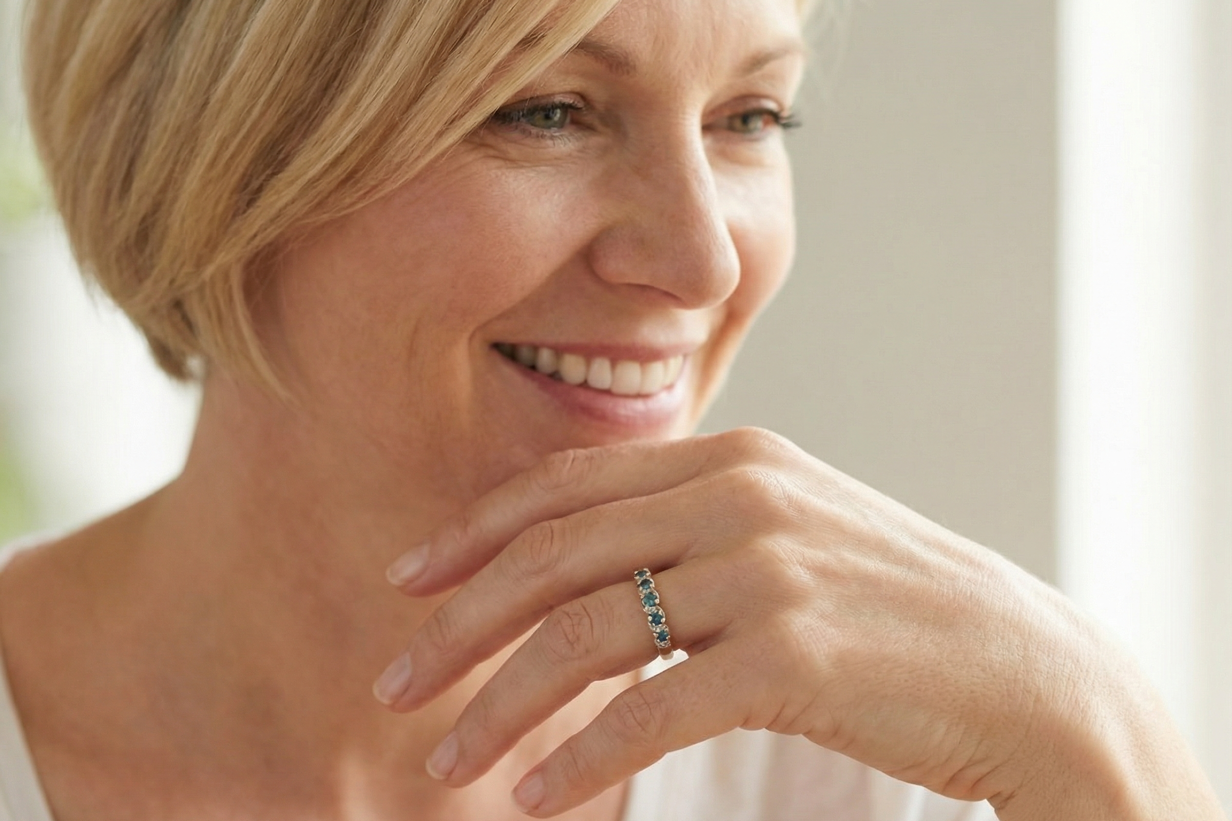 model A 9 carat gold half hoop eternity ring. Set with five blue topaz gem stones, each 2.8mm. 