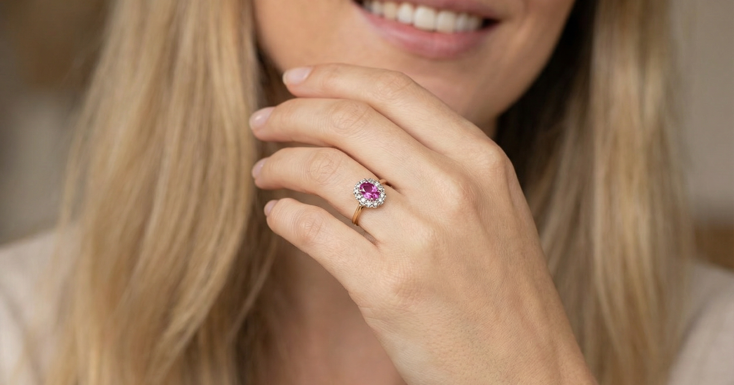 model A beautiful vintage cluster ring showcasing a vivid pink sapphire centre stone, measuring approximately 6.6 × 4.3 mm(estimated 0.65 carats).