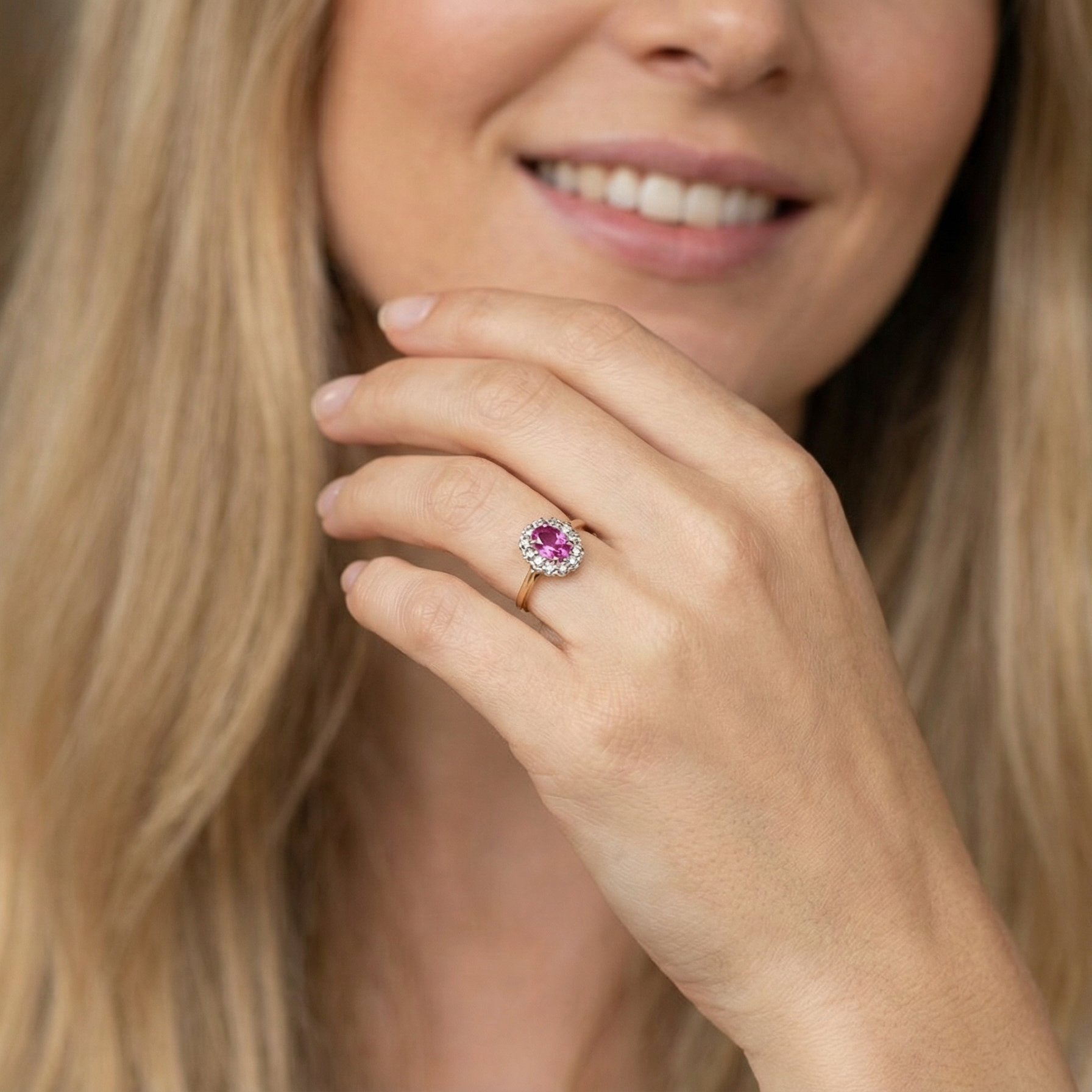 model A beautiful vintage cluster ring showcasing a vivid pink sapphire centre stone, measuring approximately 6.6 × 4.3 mm(estimated 0.65 carats).