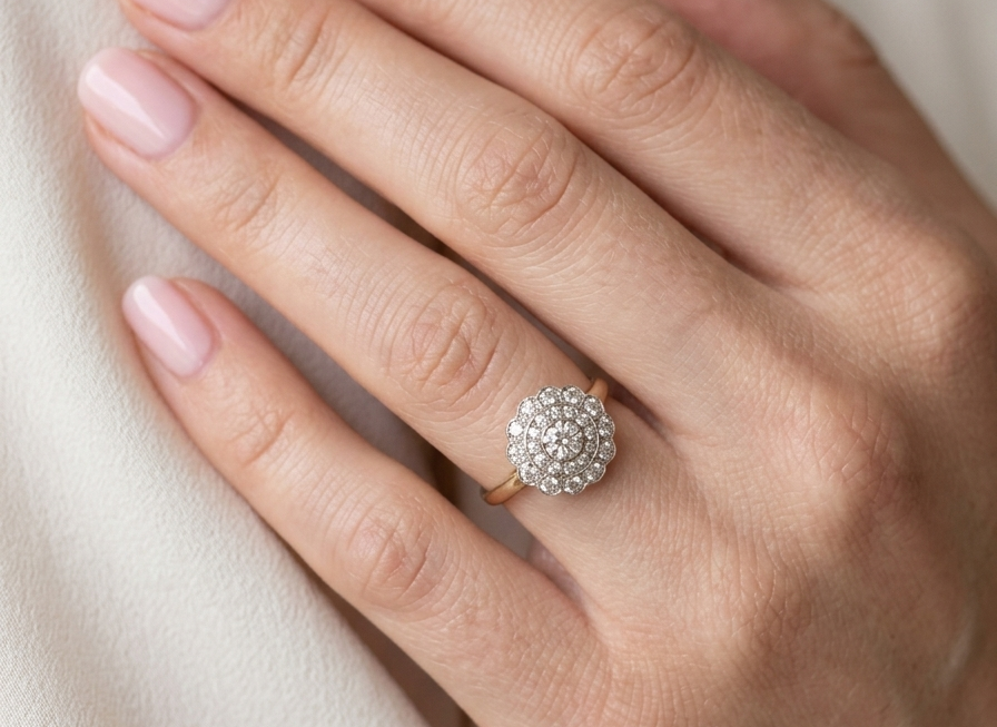 model A beautiful vintage diamond cluster ring. Know as a target cluster, the diamonds are old brilliant cut. Centre diamond 3.8mm (0.20 carats) . 
