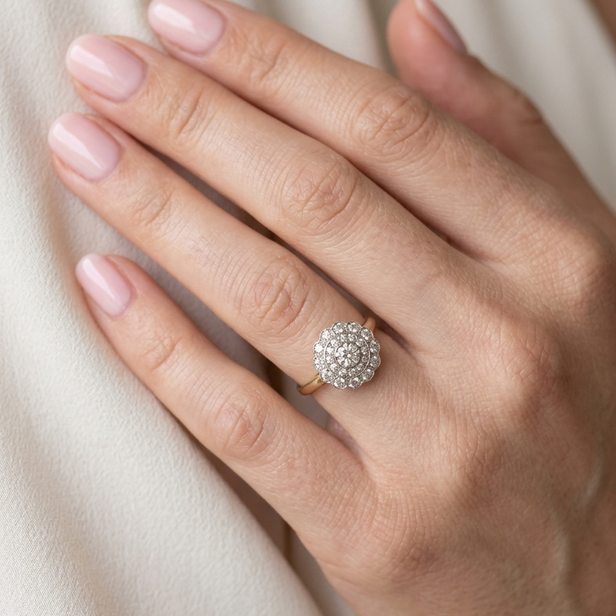 model A beautiful vintage diamond cluster ring. Know as a target cluster, the diamonds are old brilliant cut. Centre diamond 3.8mm (0.20 carats) . 