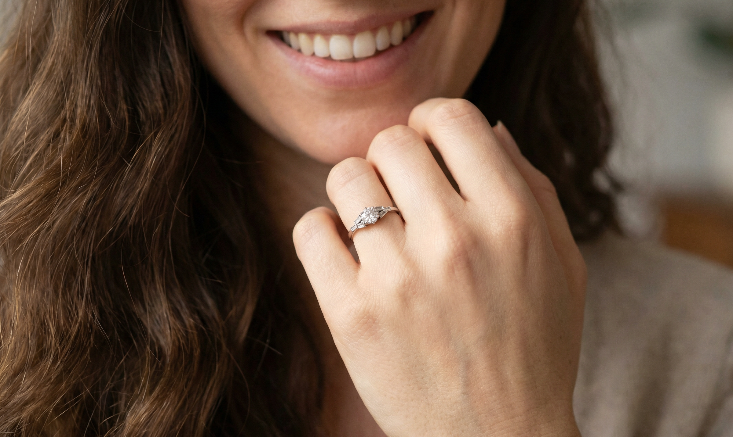 model A beautifully proportioned Art Deco solitaire ring showcasing a sparkling old brilliant cut white diamond