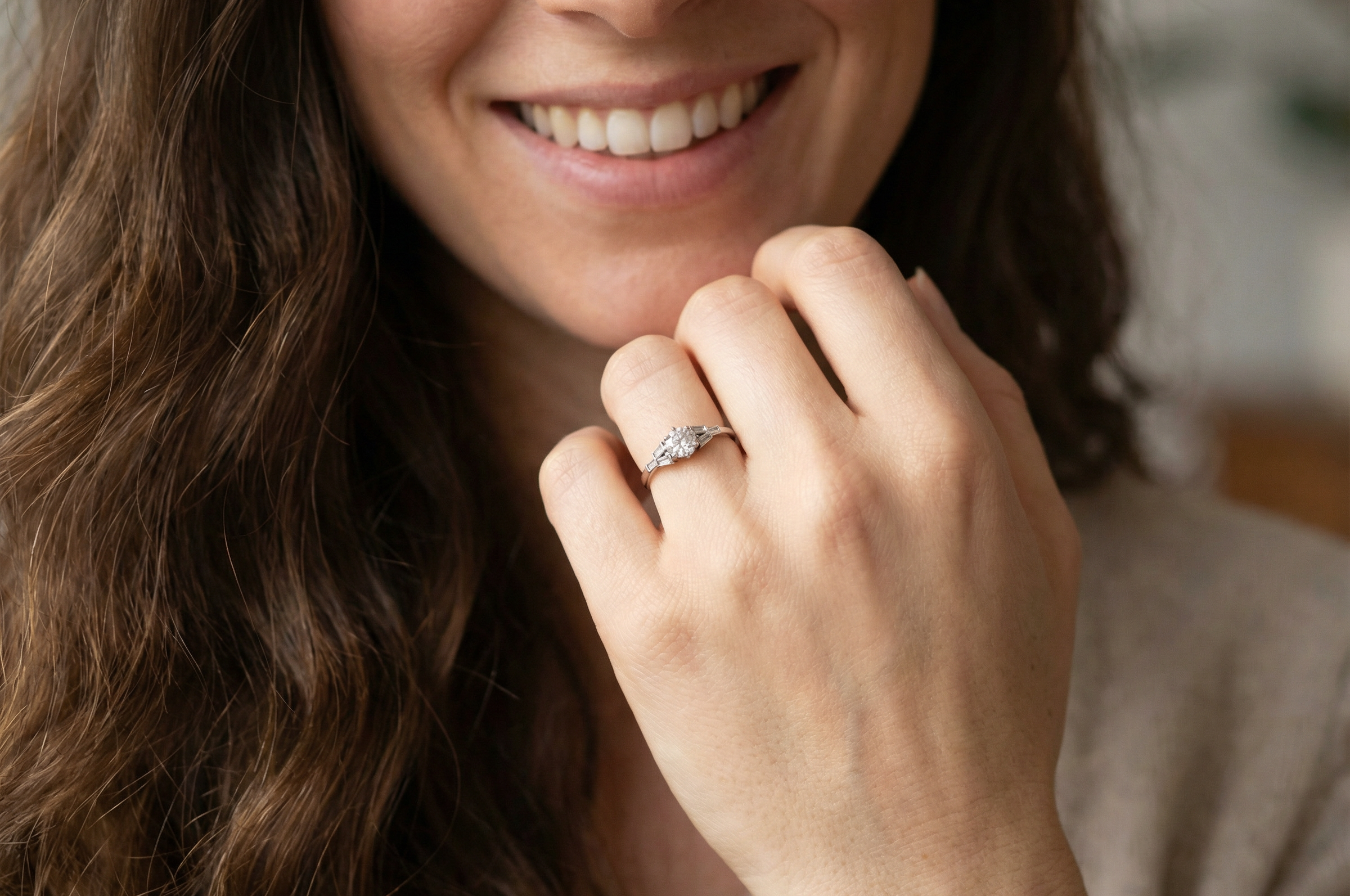 model A beautifully proportioned Art Deco solitaire ring showcasing a sparkling old brilliant cut white diamond