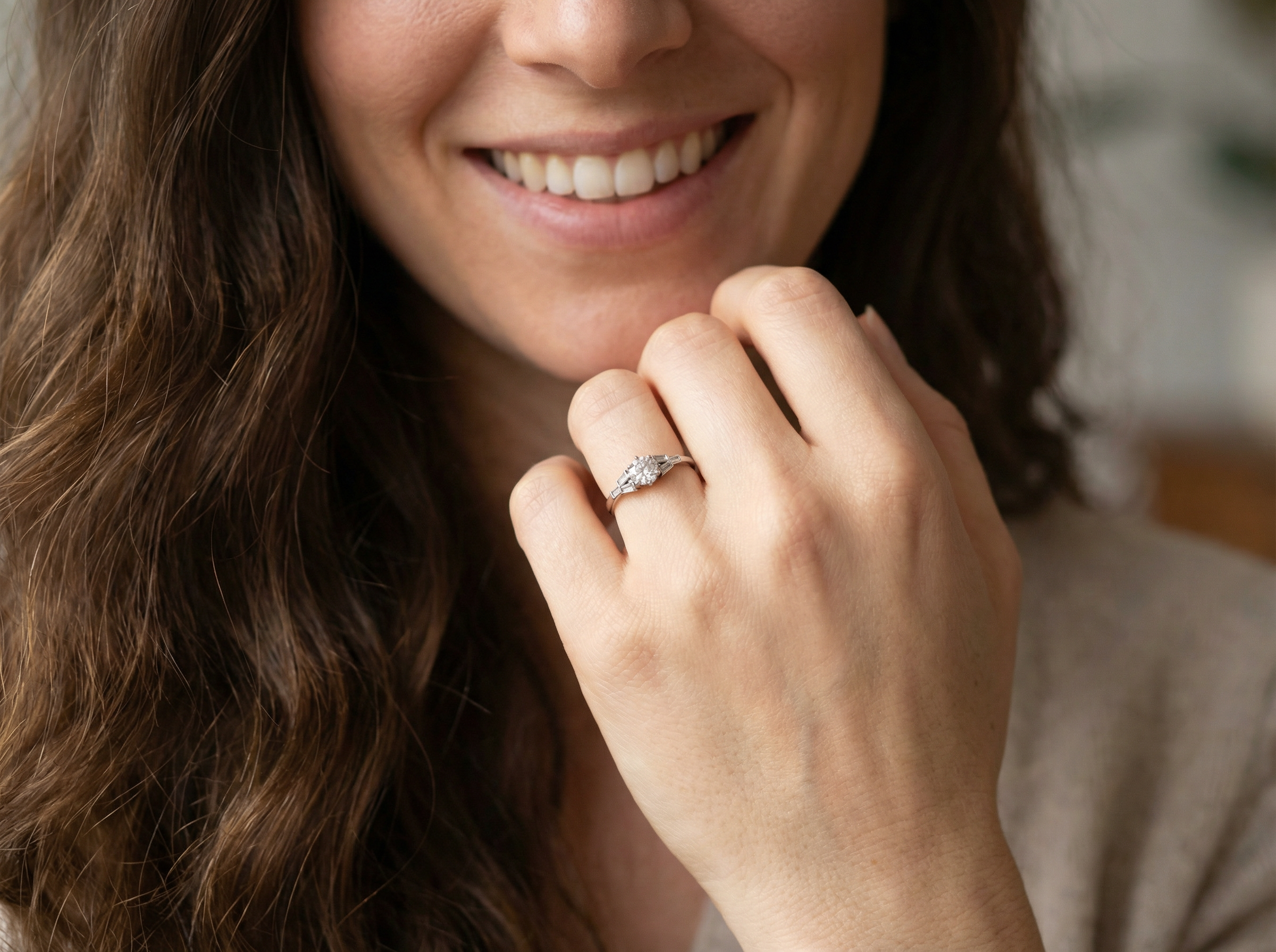 model A beautifully proportioned Art Deco solitaire ring showcasing a sparkling old brilliant cut white diamond