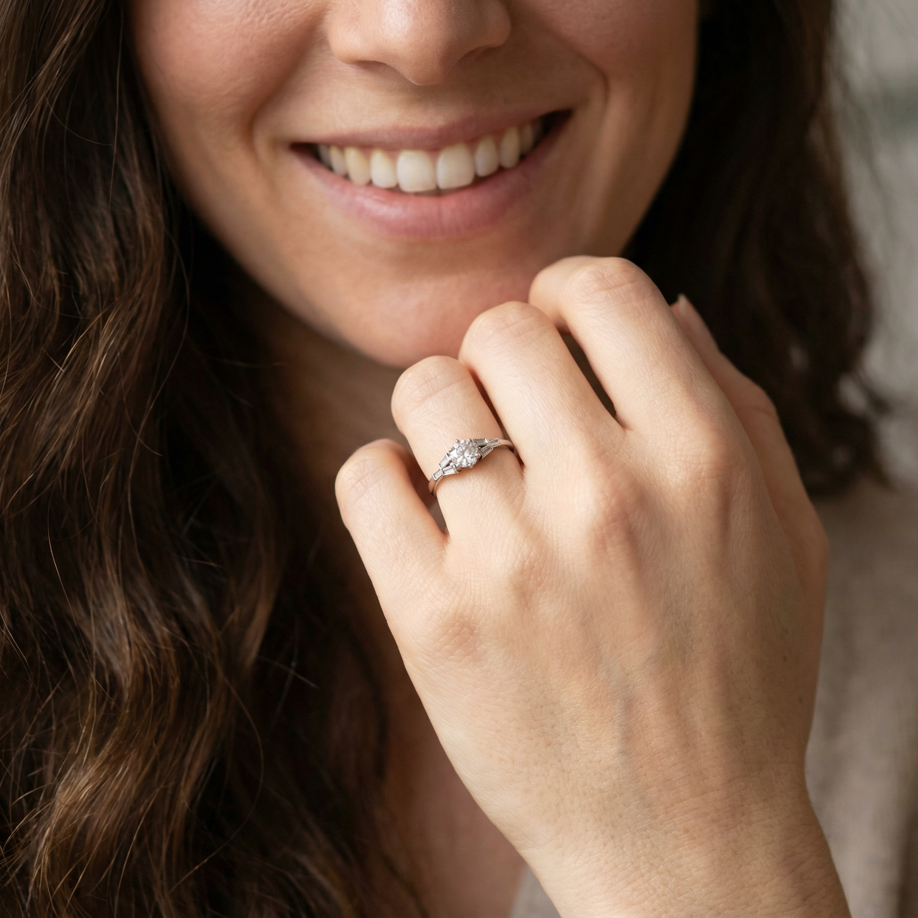 model A beautifully proportioned Art Deco solitaire ring showcasing a sparkling old brilliant cut white diamond