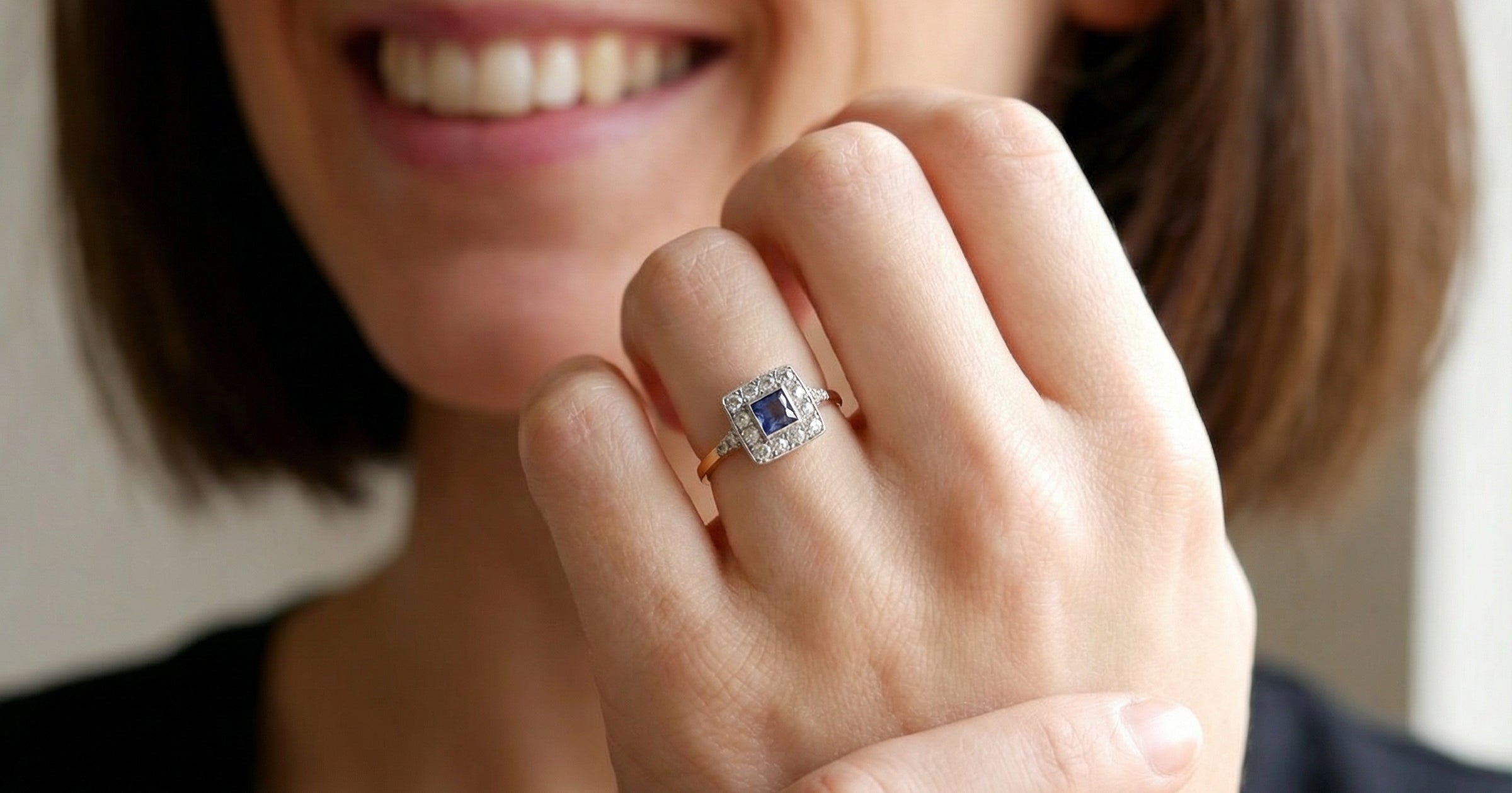 model A fine Art Deco cluster ring. The centre stone a square sapphire 5x5mm (est 0.50 carats) in a mille grain setting.
