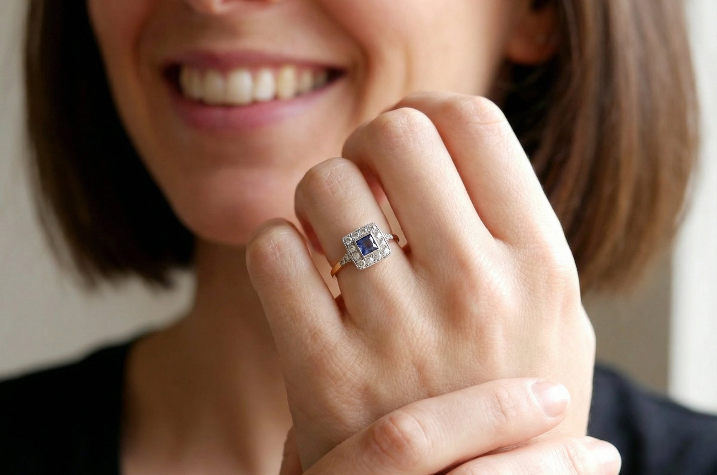 model A fine Art Deco cluster ring. The centre stone a square sapphire 5x5mm (est 0.50 carats) in a mille grain setting.