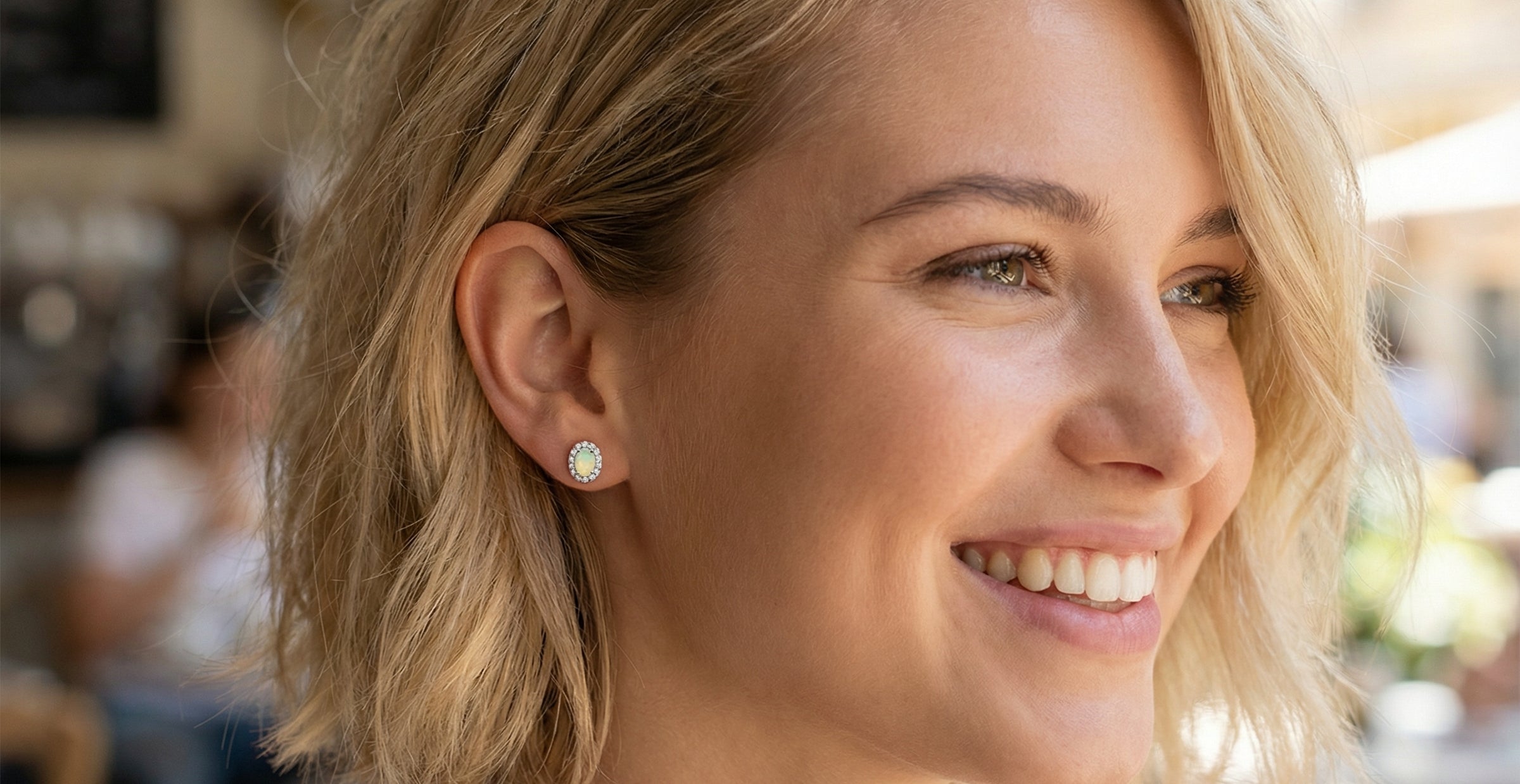 model A fine and elegant pair of platinum* stud earrings, each beautifully set with an exceptional white opal measuring 7 x 5mm. T