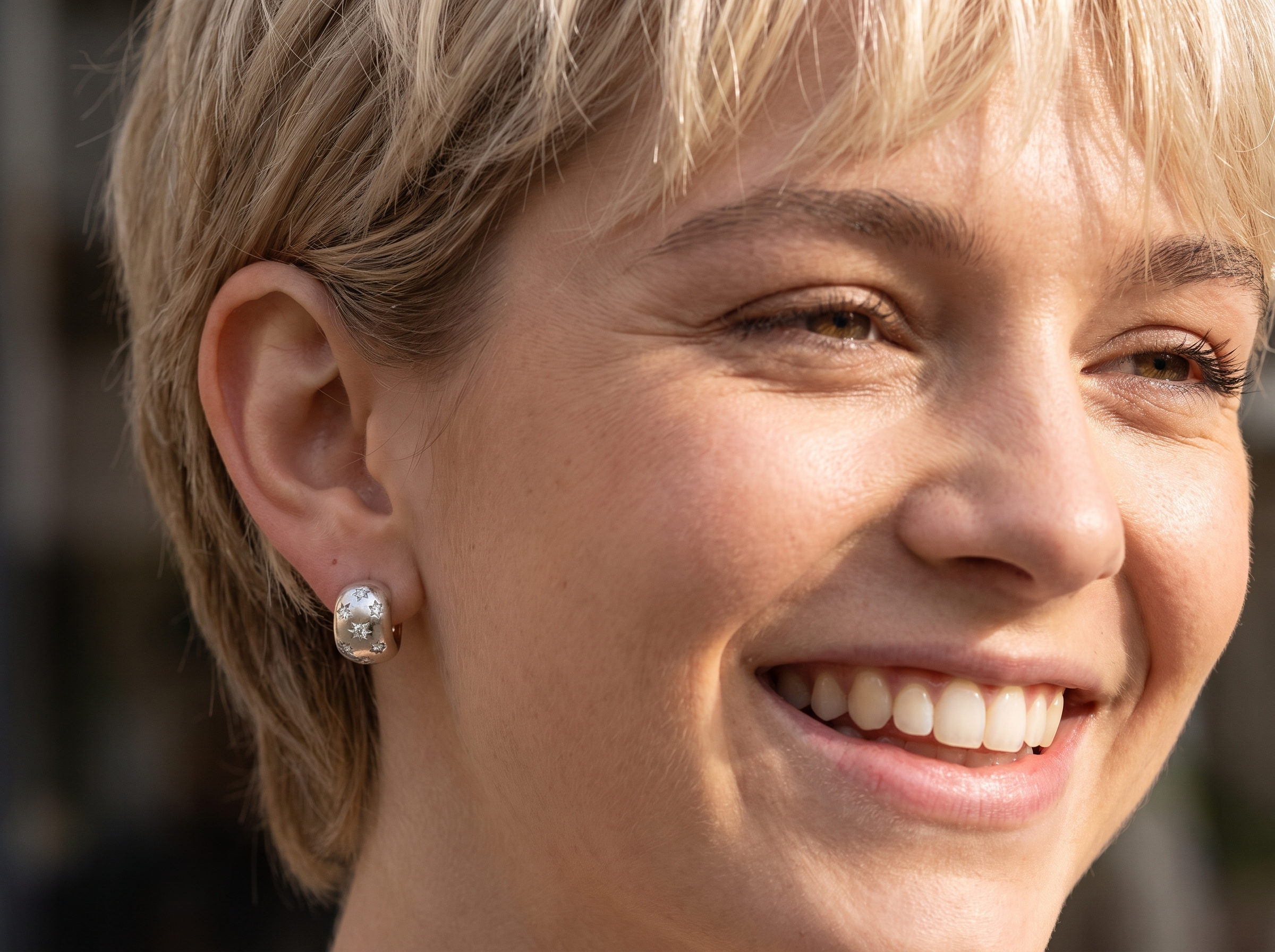 model A fine pair of cuff style hoop earrings. The front part is 18 carat white gold * set with seven small white diamonds, e