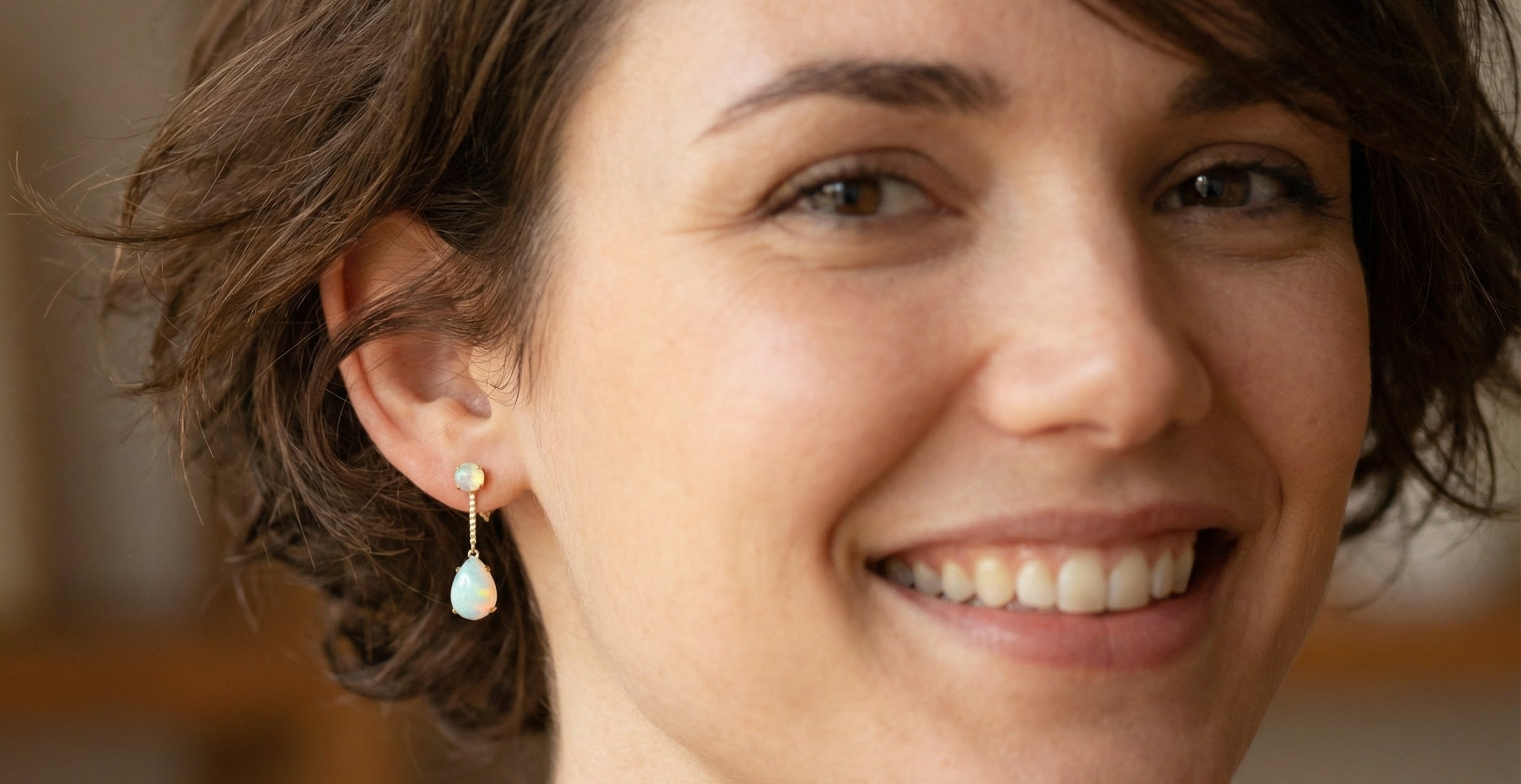 model A fine pair of drop earrings. Suspending from a round opal which is at the head of the post, (measures 4mm) a pear shaped opal 8x6mm, and attached to a 9mm box link chain.