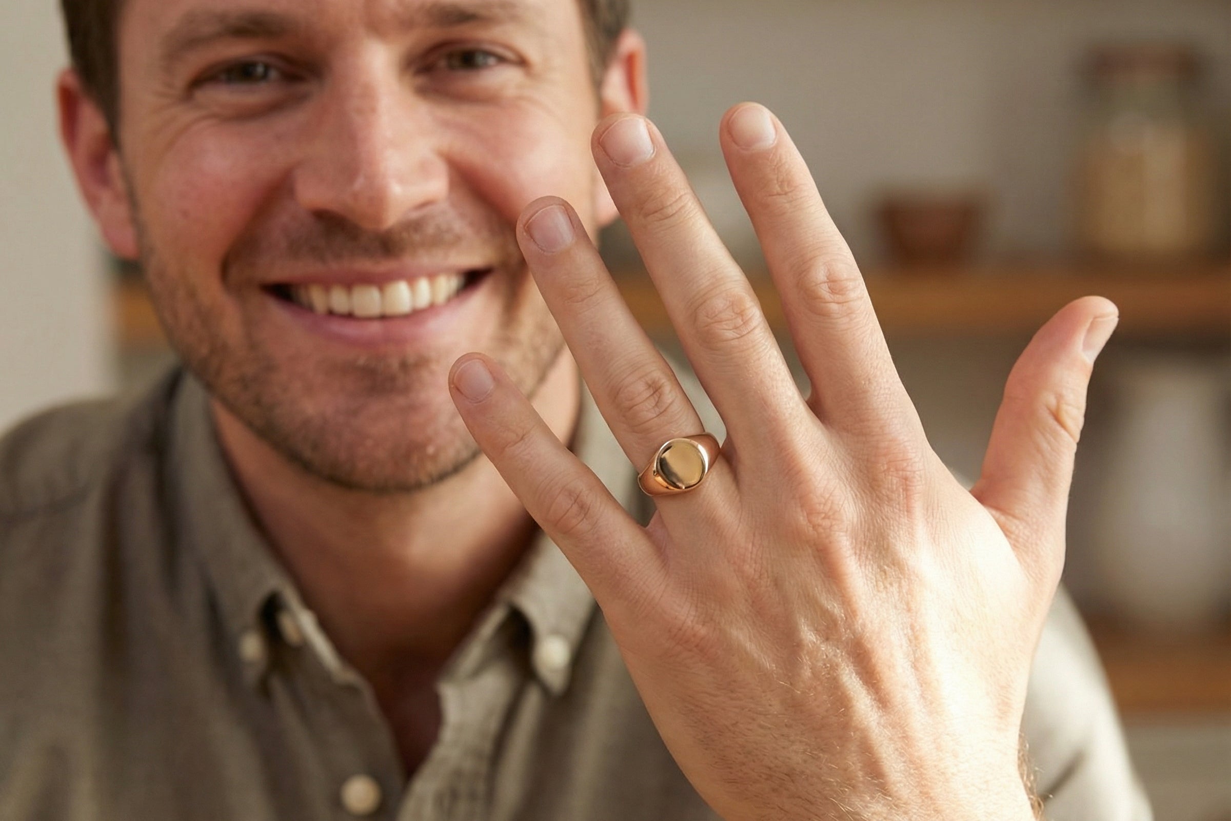model A gentleman's 9 carat rose gold signet ring. The head is oval shaped 13x13mm, totally plain with a seamless surface to the shoulders.