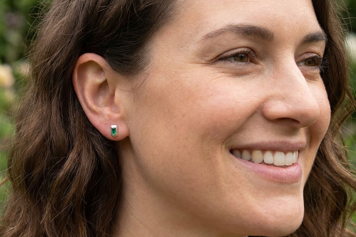 model A lovely modern pair of earrings. Each emerald is rectangular, step cut,