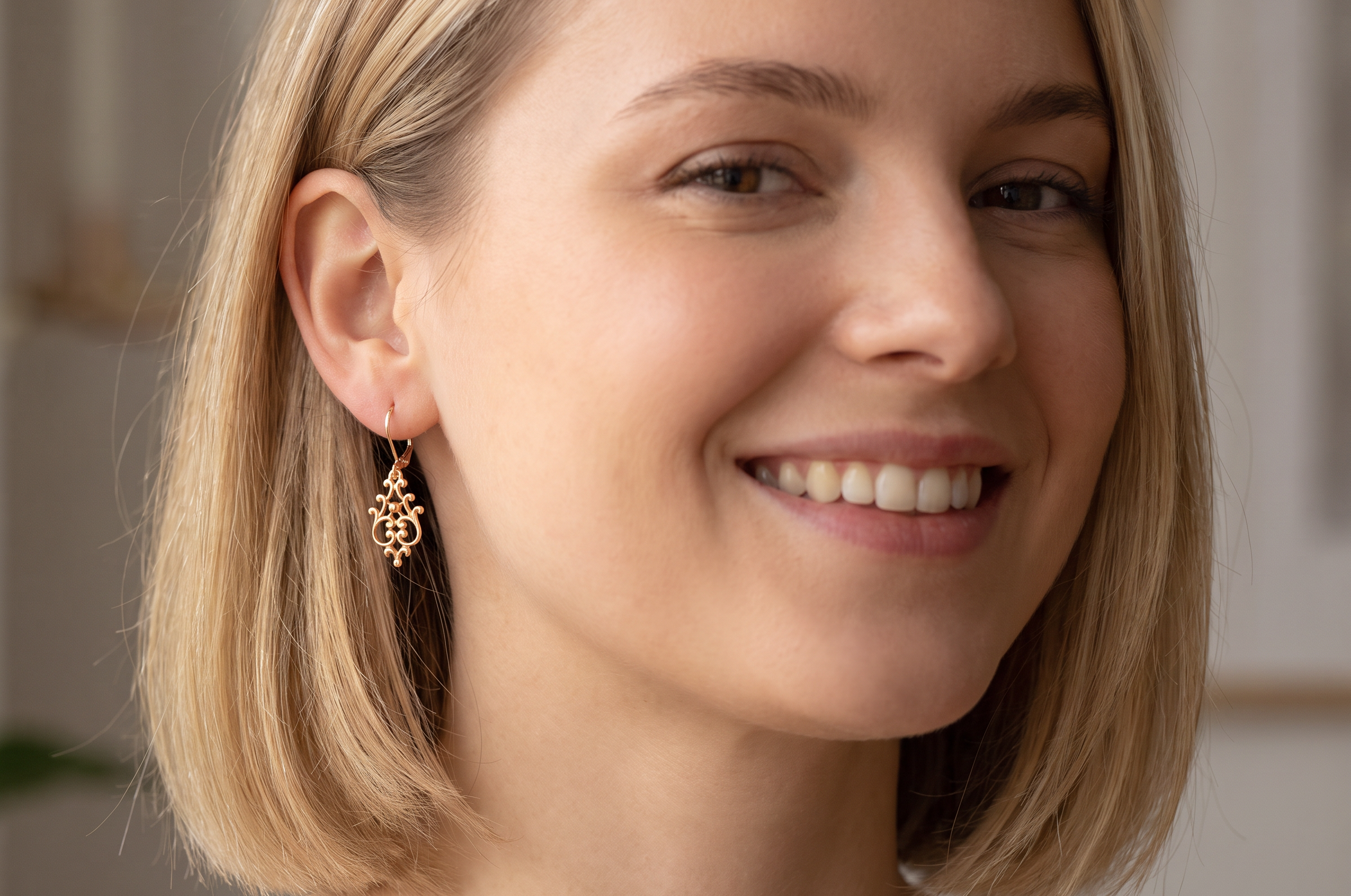 model A pair of 9 carat gold* drop earrings. Openwork Celtic look design.