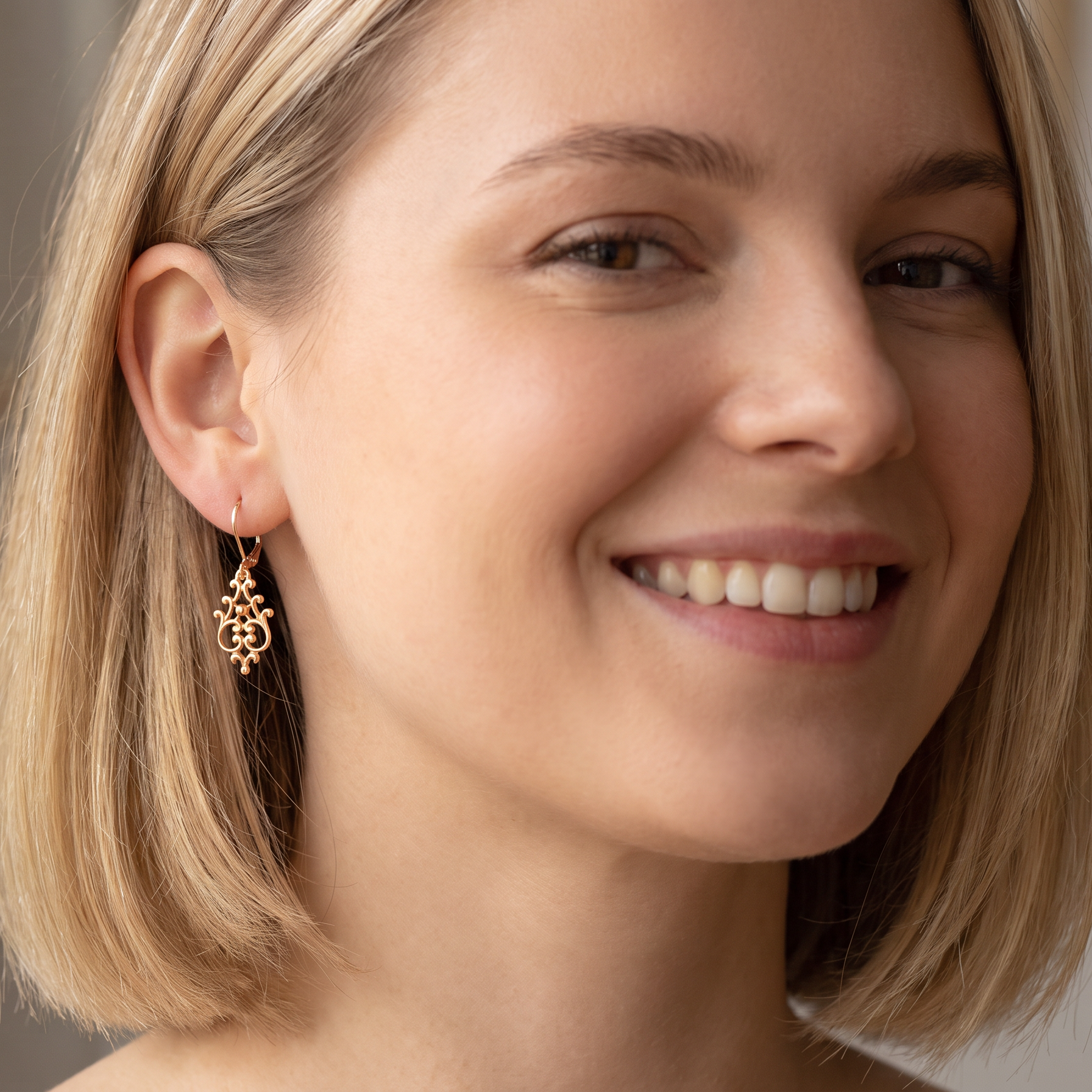 model A pair of 9 carat gold* drop earrings. Openwork Celtic look design.
