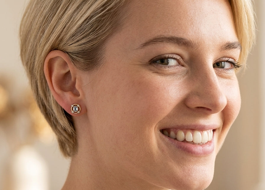 model A pretty pair of earrings. Each is set with an aquamarine centre stone, 6x4.5mm, cushion shaped.