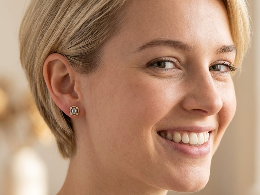 model A pretty pair of earrings. Each is set with an aquamarine centre stone, 6x4.5mm, cushion shaped.