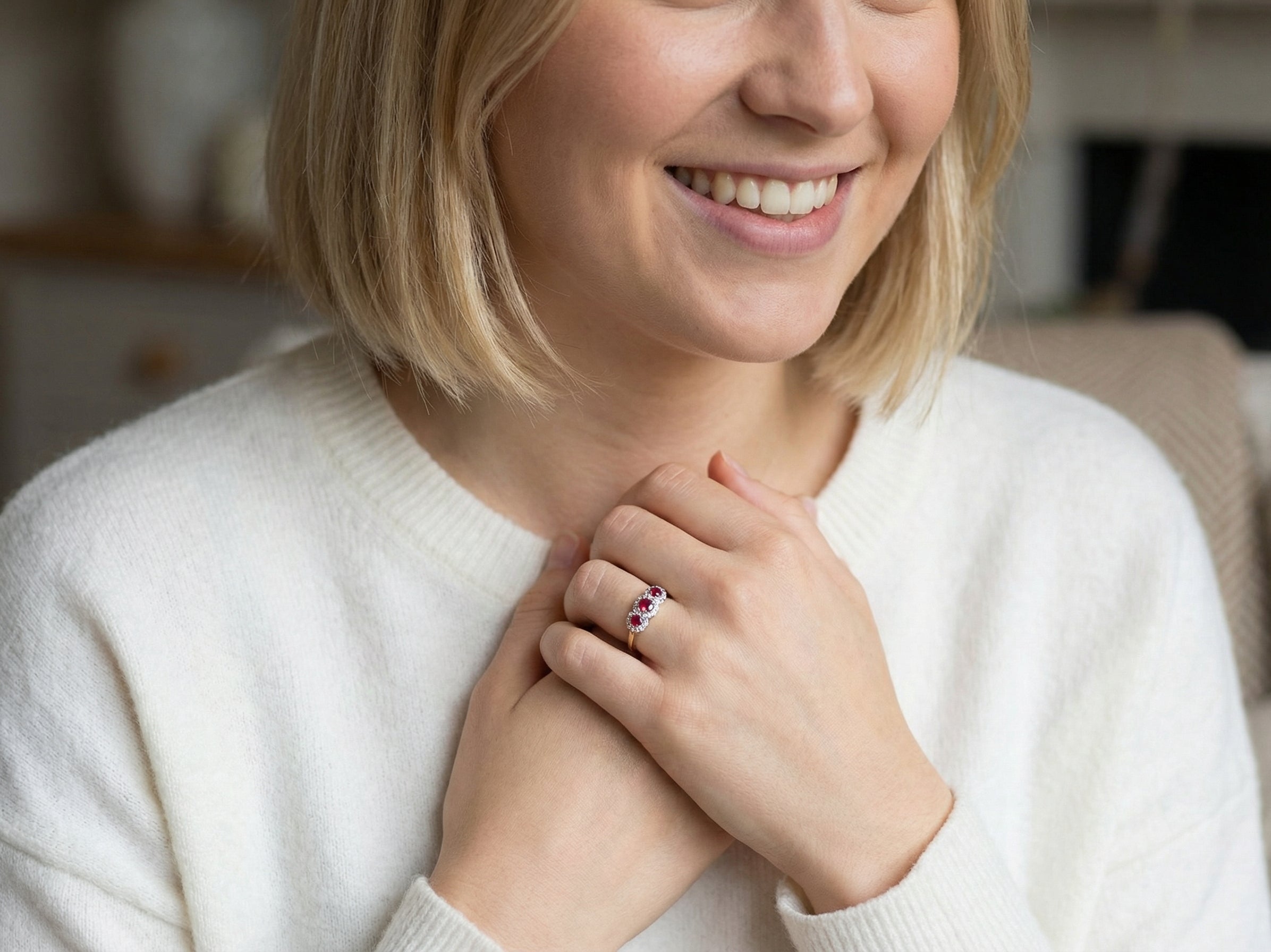 model A striking triple cluster ring crafted in 18 carat gold, dating circa 1990–2000, and fully hallmarked in the UK.
✨ Design & Gemstones
Three deep red rubies set to the centre of each cluster