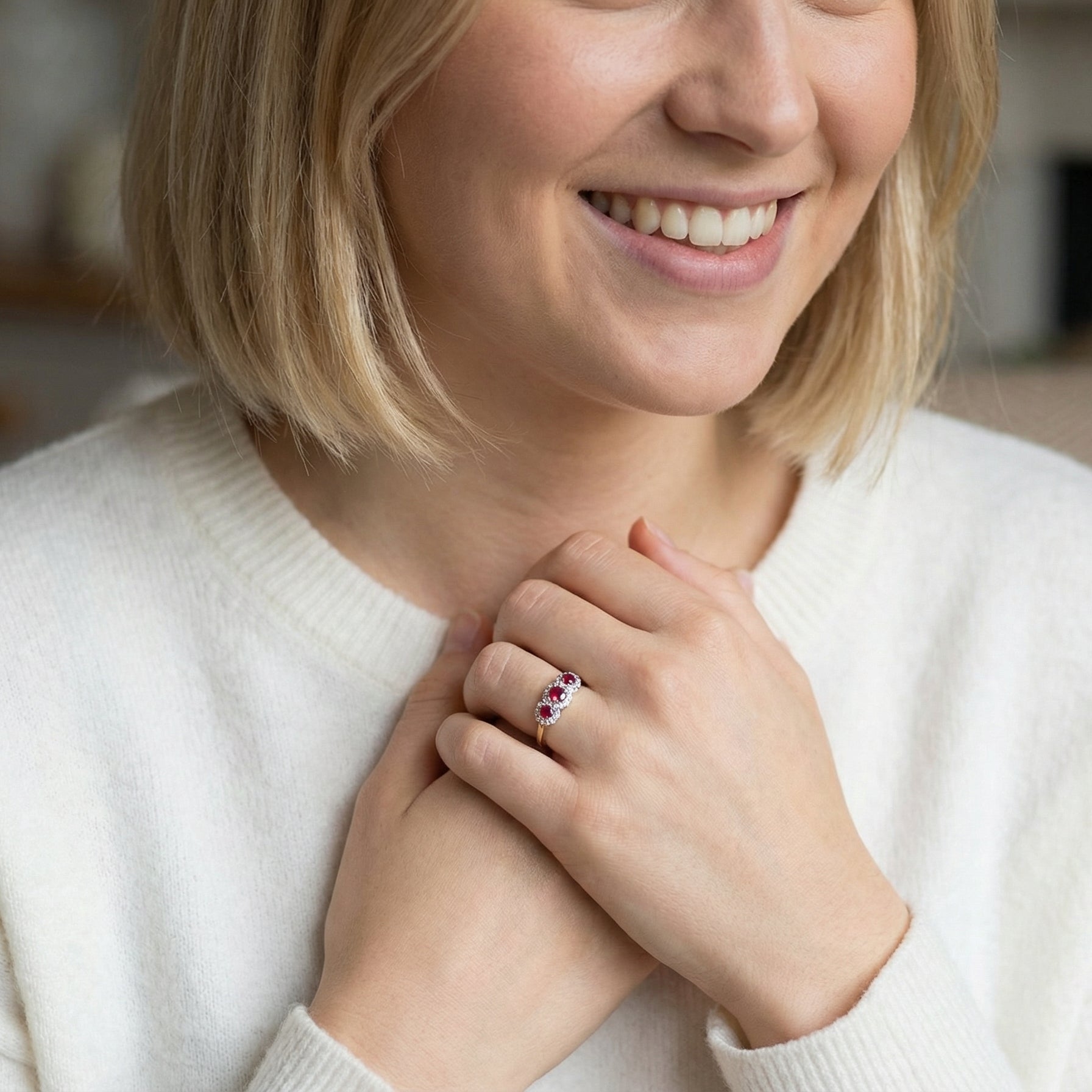 model A striking triple cluster ring crafted in 18 carat gold, dating circa 1990–2000, and fully hallmarked in the UK.
✨ Design & Gemstones
Three deep red rubies set to the centre of each cluster