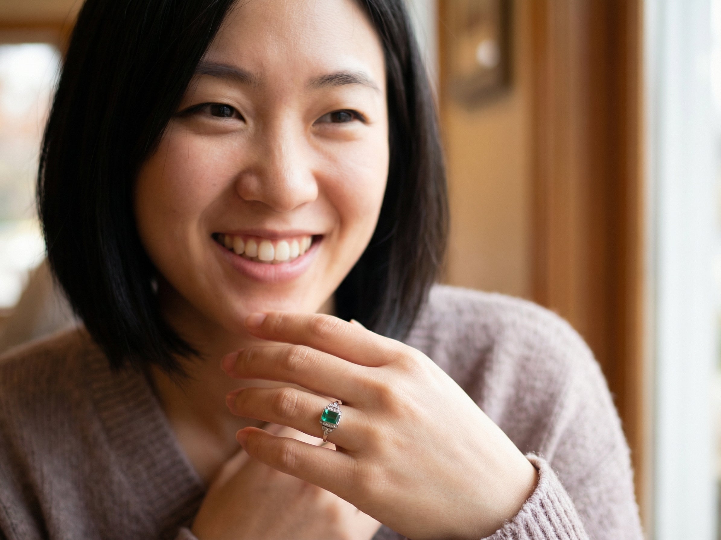 model A vintage early 20th century dress ring. The centre stone a vibrant crystal clear green paste stone, 8x6mm.