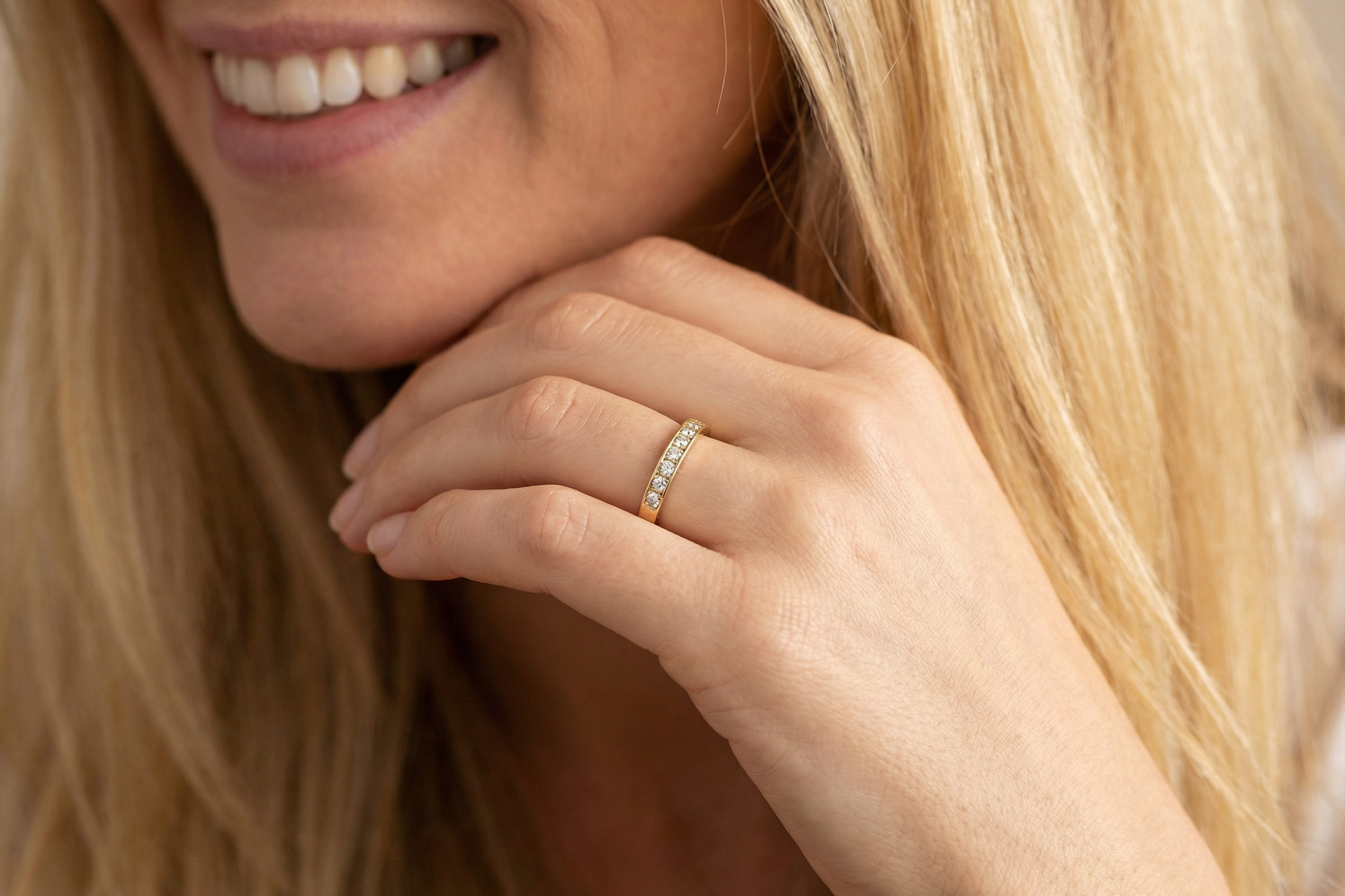 model An 18 carat gold half-hoop eternity ring, set with eight brilliant-cut white diamonds