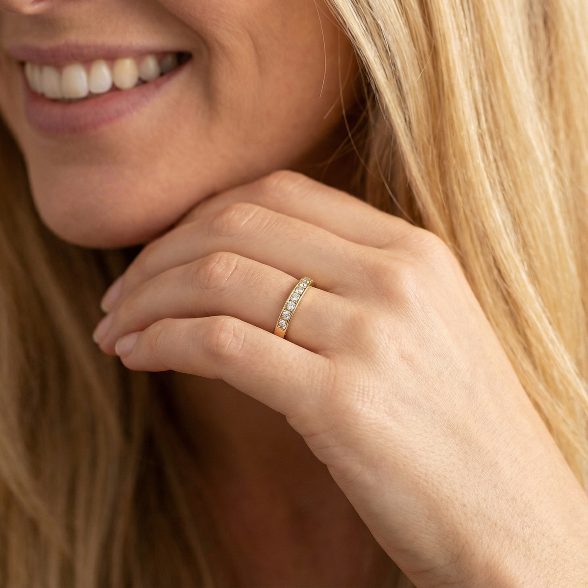 model An 18 carat gold half-hoop eternity ring, set with eight brilliant-cut white diamonds