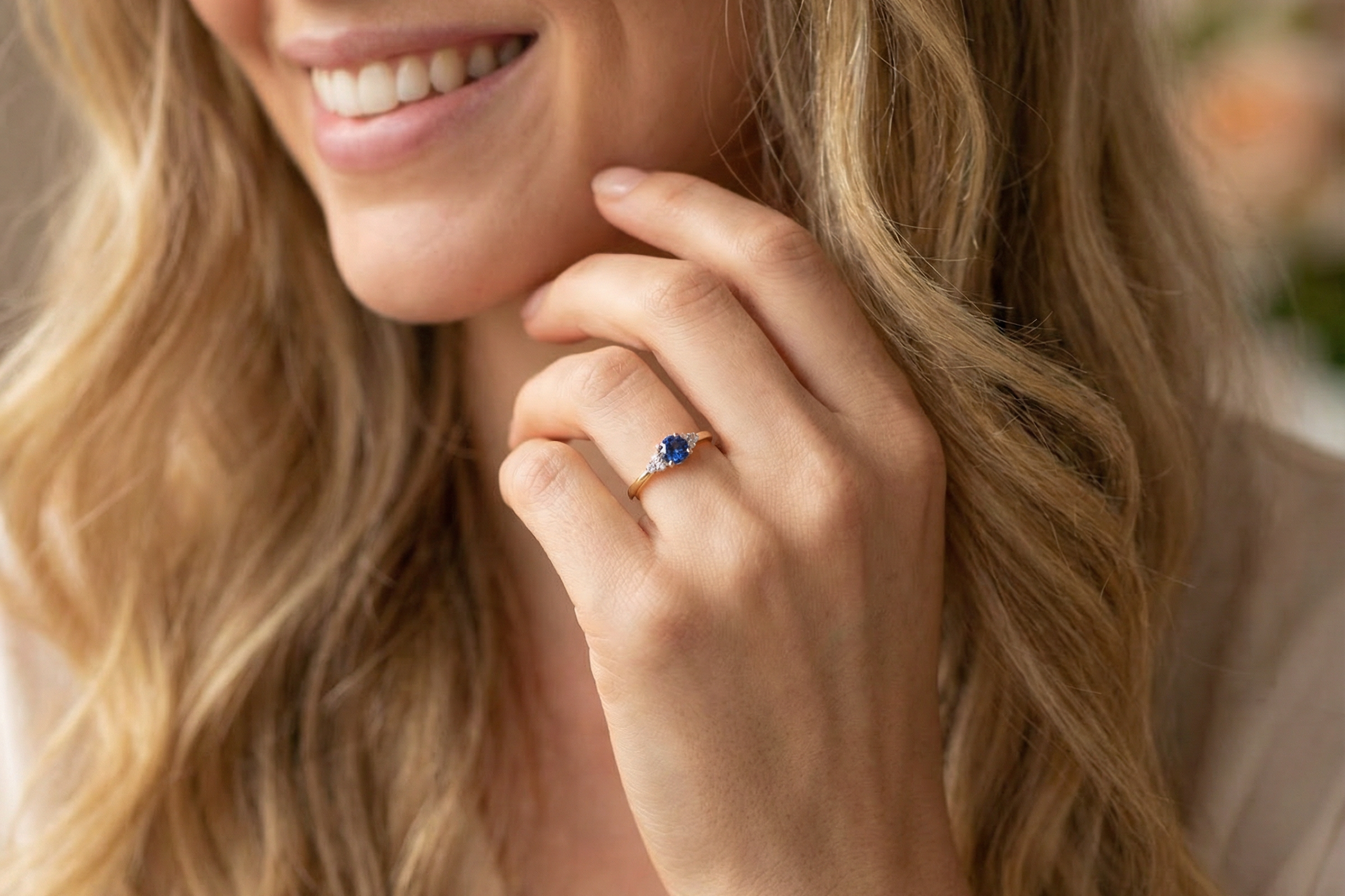 model An 18 carat gold ring set with a vibrant blue sapphire,