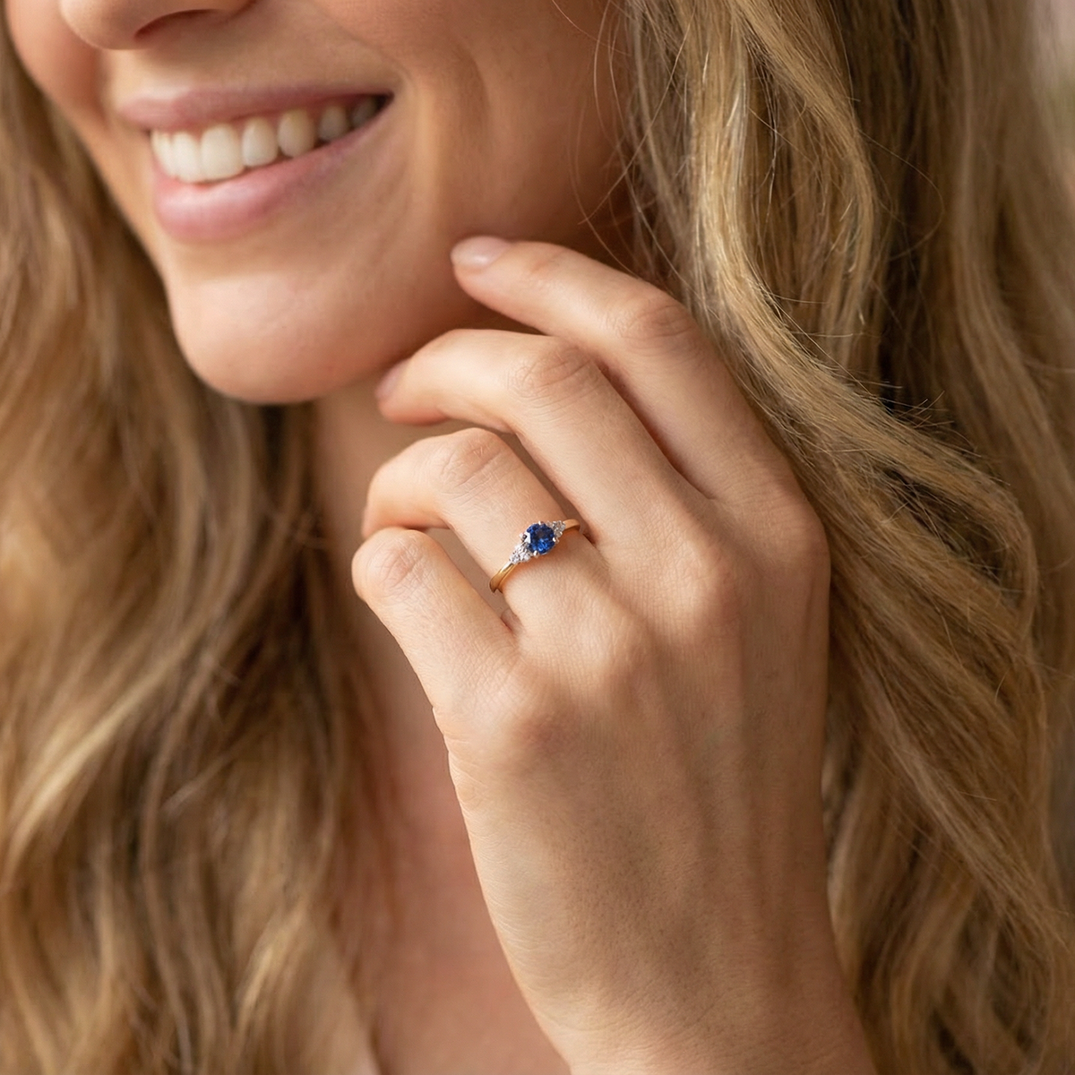 model An 18 carat gold ring set with a vibrant blue sapphire,
