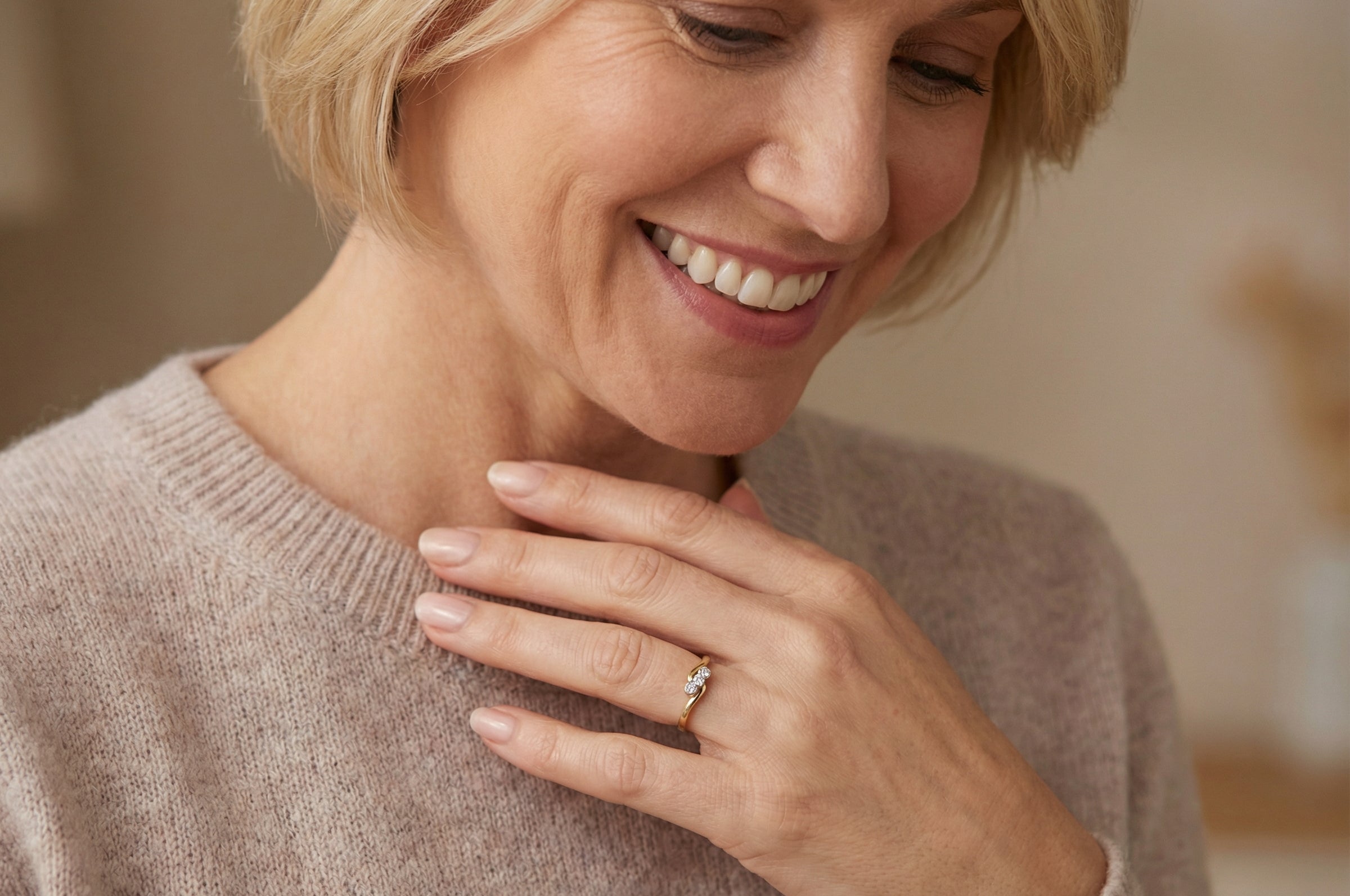 model An 18 carat yellow gold three stone ring, cross over style, and set with brilliant cut white diamonds.
Centre stone 3mm (0.10 carats)