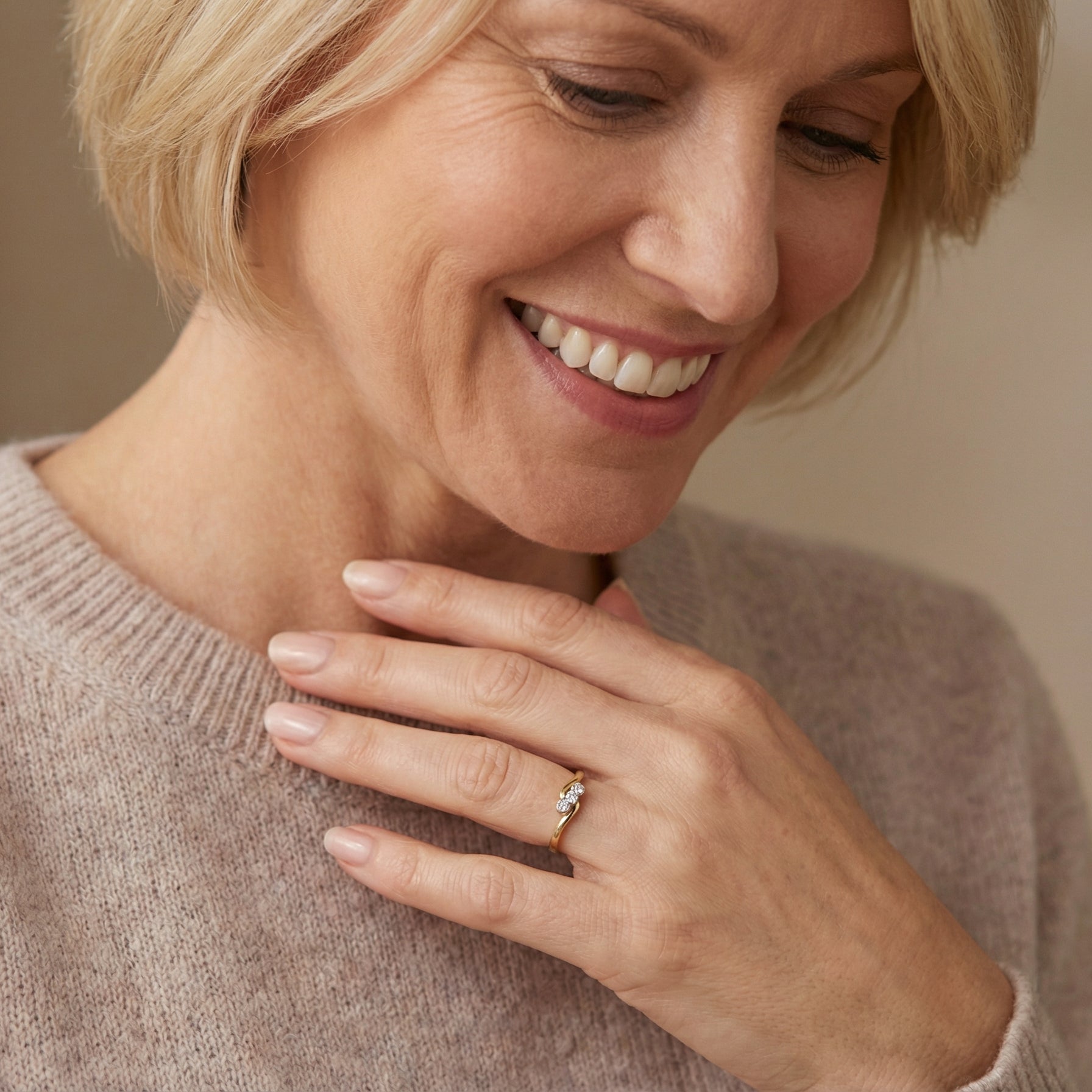 model An 18 carat yellow gold three stone ring, cross over style, and set with brilliant cut white diamonds.
Centre stone 3mm (0.10 carats)