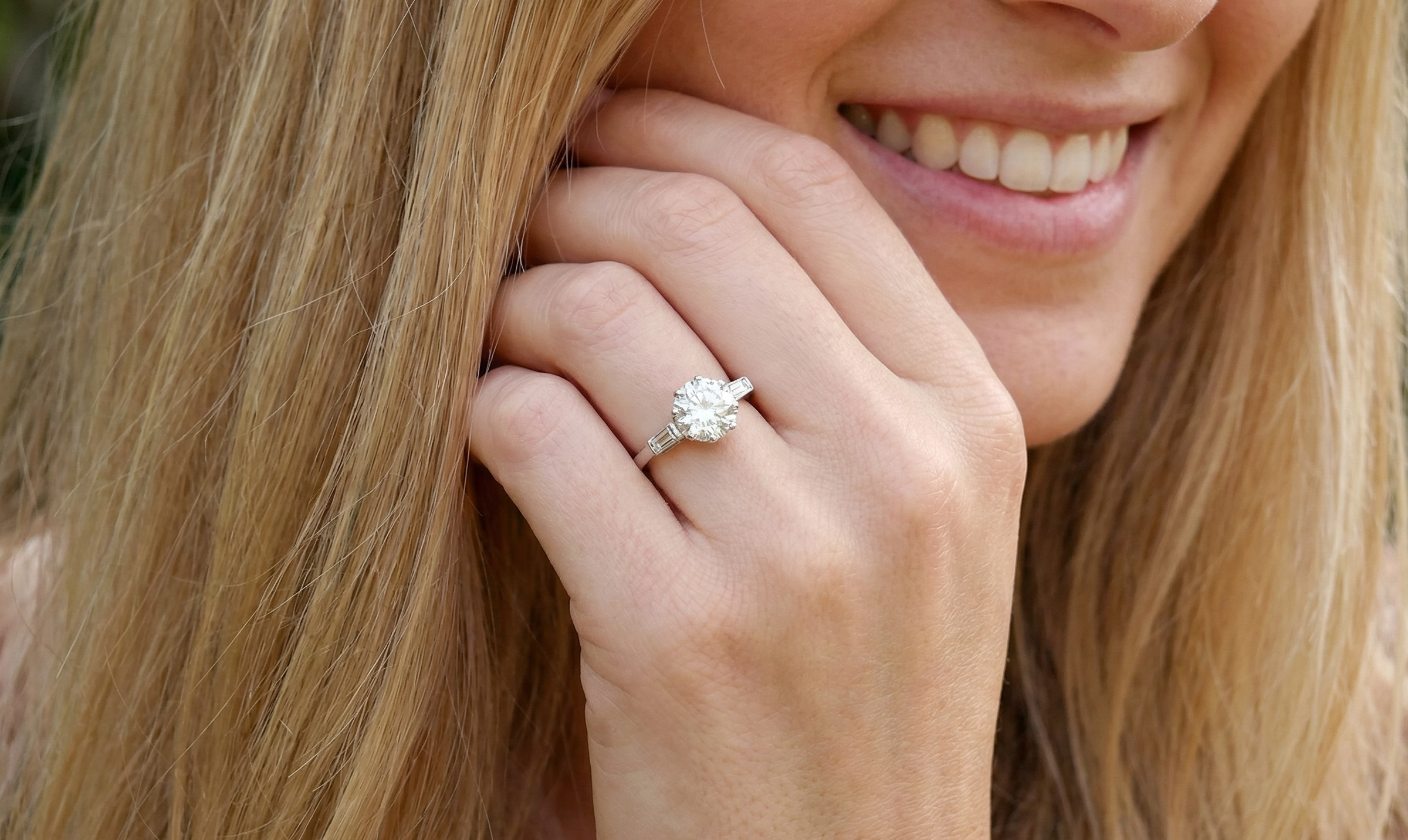 model An Art Deco solitaire ring showcasing a beautiful 1.75 carat diamond