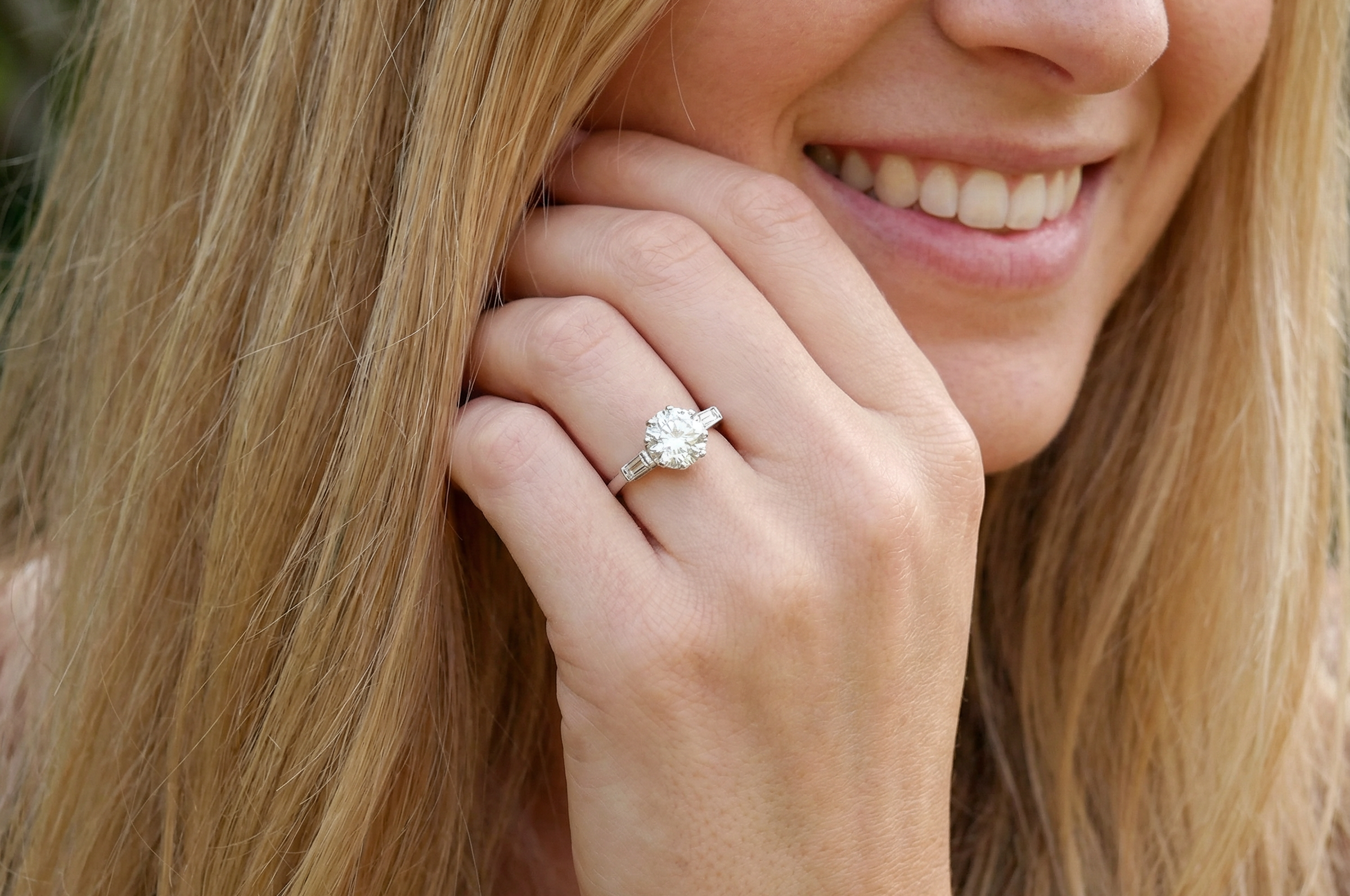 model An Art Deco solitaire ring showcasing a beautiful 1.75 carat diamond