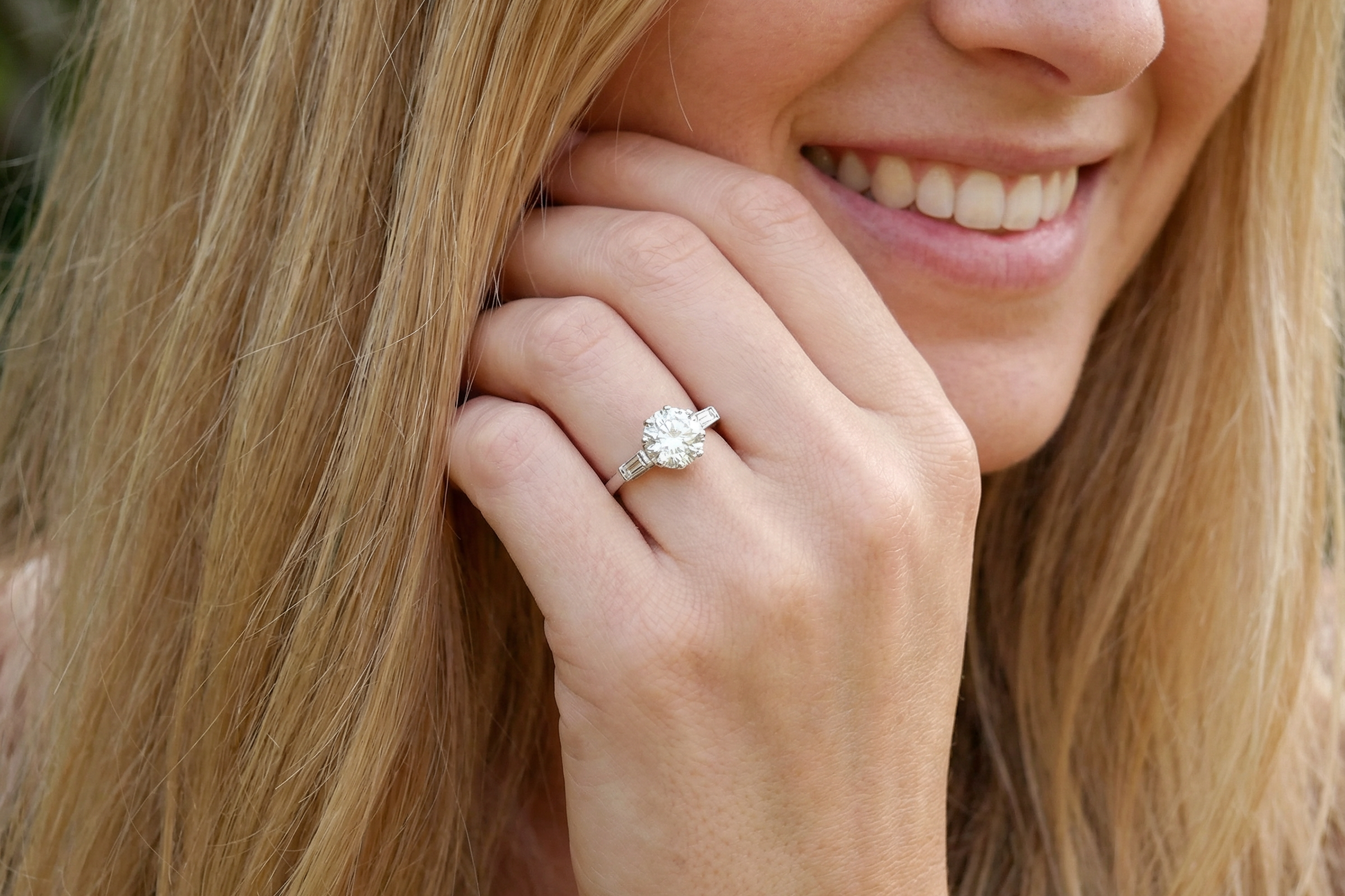 model An Art Deco solitaire ring showcasing a beautiful 1.75 carat diamond