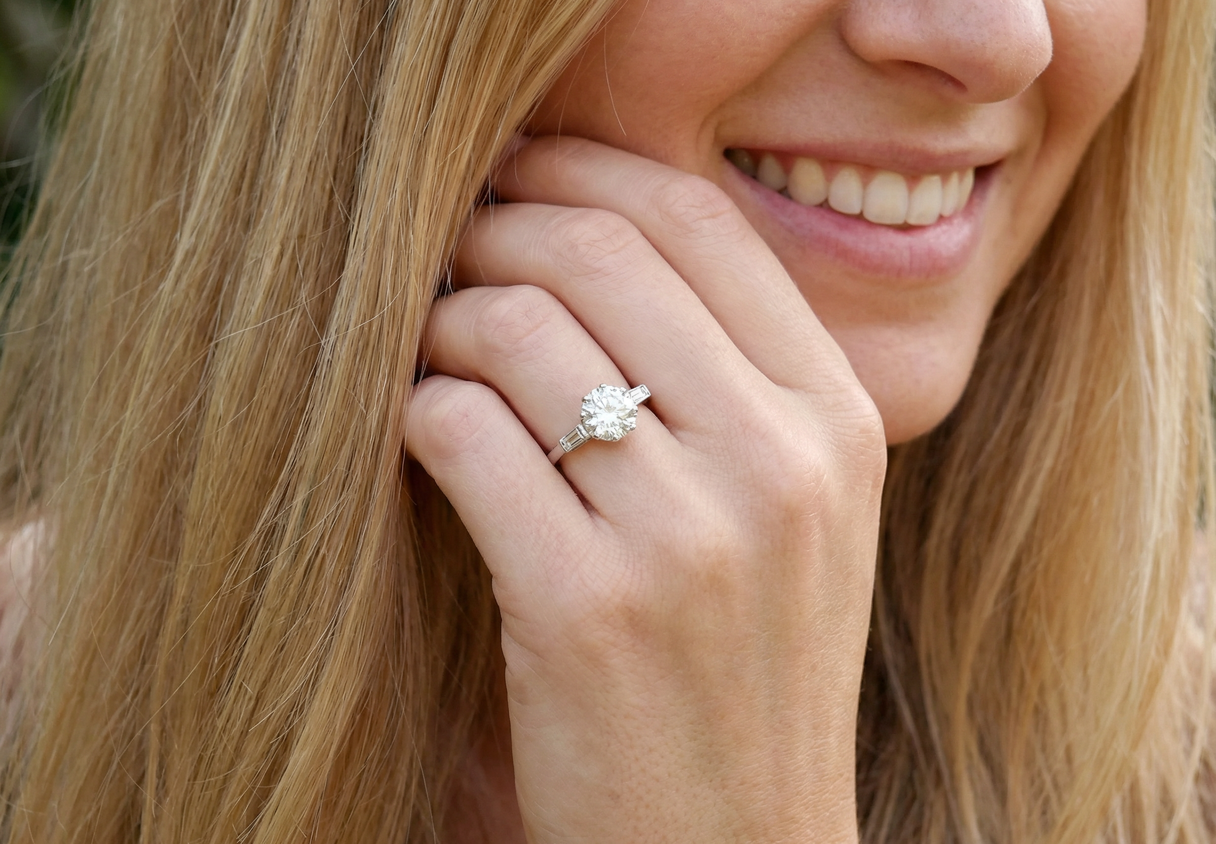 model An Art Deco solitaire ring showcasing a beautiful 1.75 carat diamond