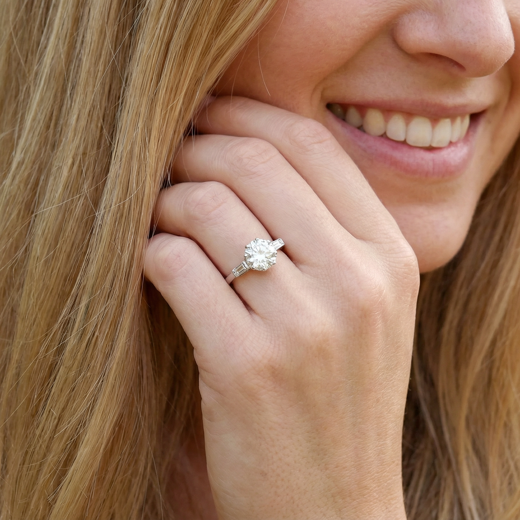 model An Art Deco solitaire ring showcasing a beautiful 1.75 carat diamond