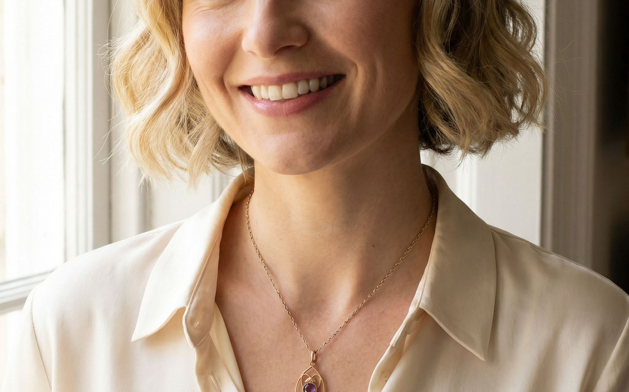 model An Edwardian pendant set with two amethyst gemstones