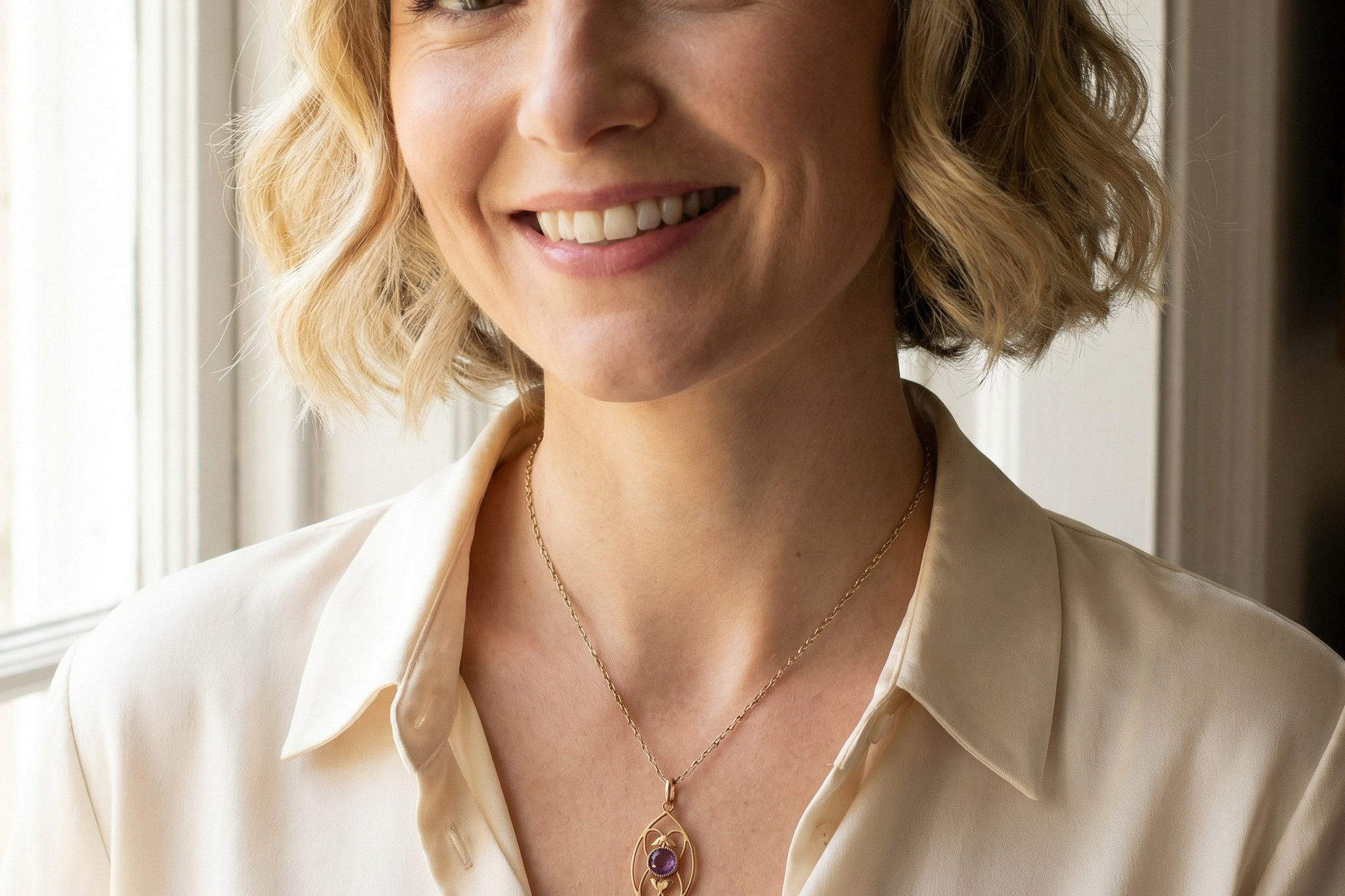 model An Edwardian pendant set with two amethyst gemstones