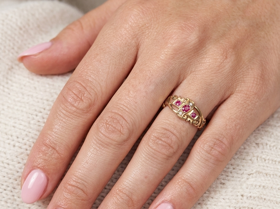 model An early 20th century ring. 18 carat gold, set with three rubies. 