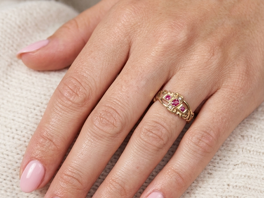 model An early 20th century ring. 18 carat gold, set with three rubies. 