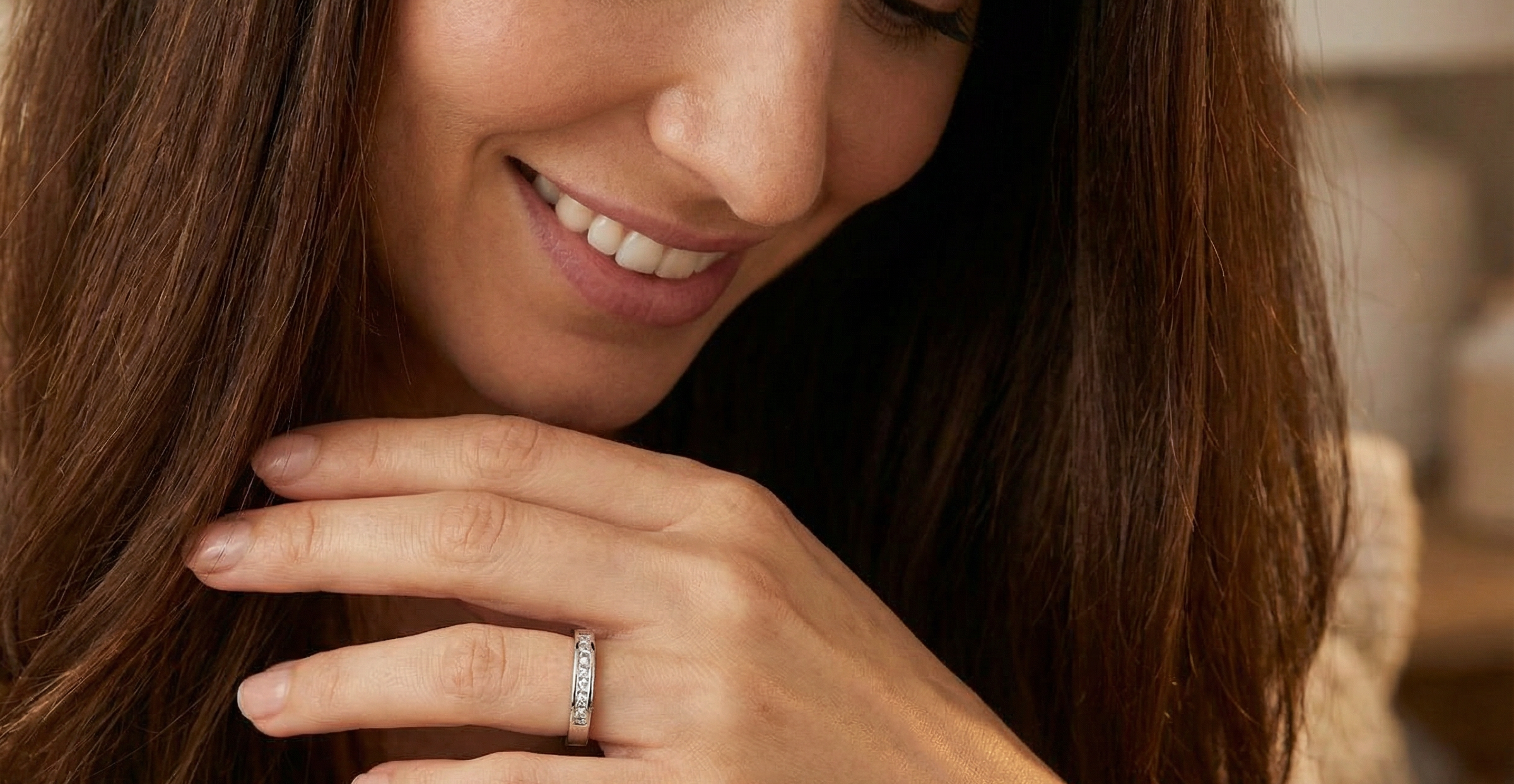model An elegant half-hoop eternity ring set with nine princess-cut white diamonds, each measuring approximately 2.5mm, with a total estimated diamond weight of 0.90 carats.