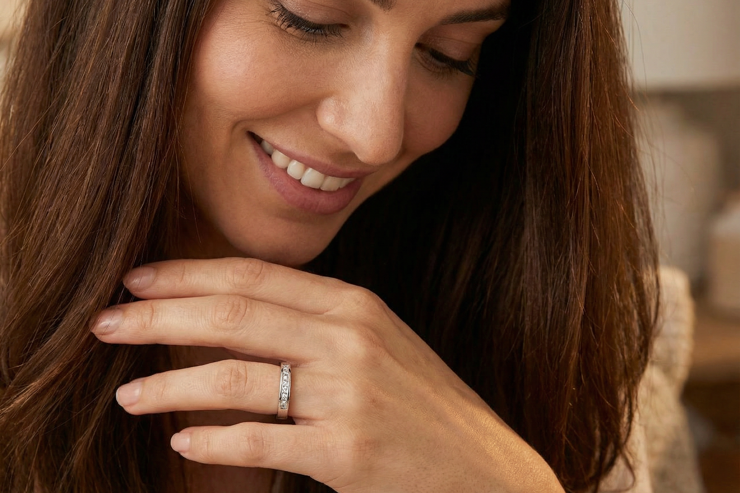 model An elegant half-hoop eternity ring set with nine princess-cut white diamonds, each measuring approximately 2.5mm, with a total estimated diamond weight of 0.90 carats.