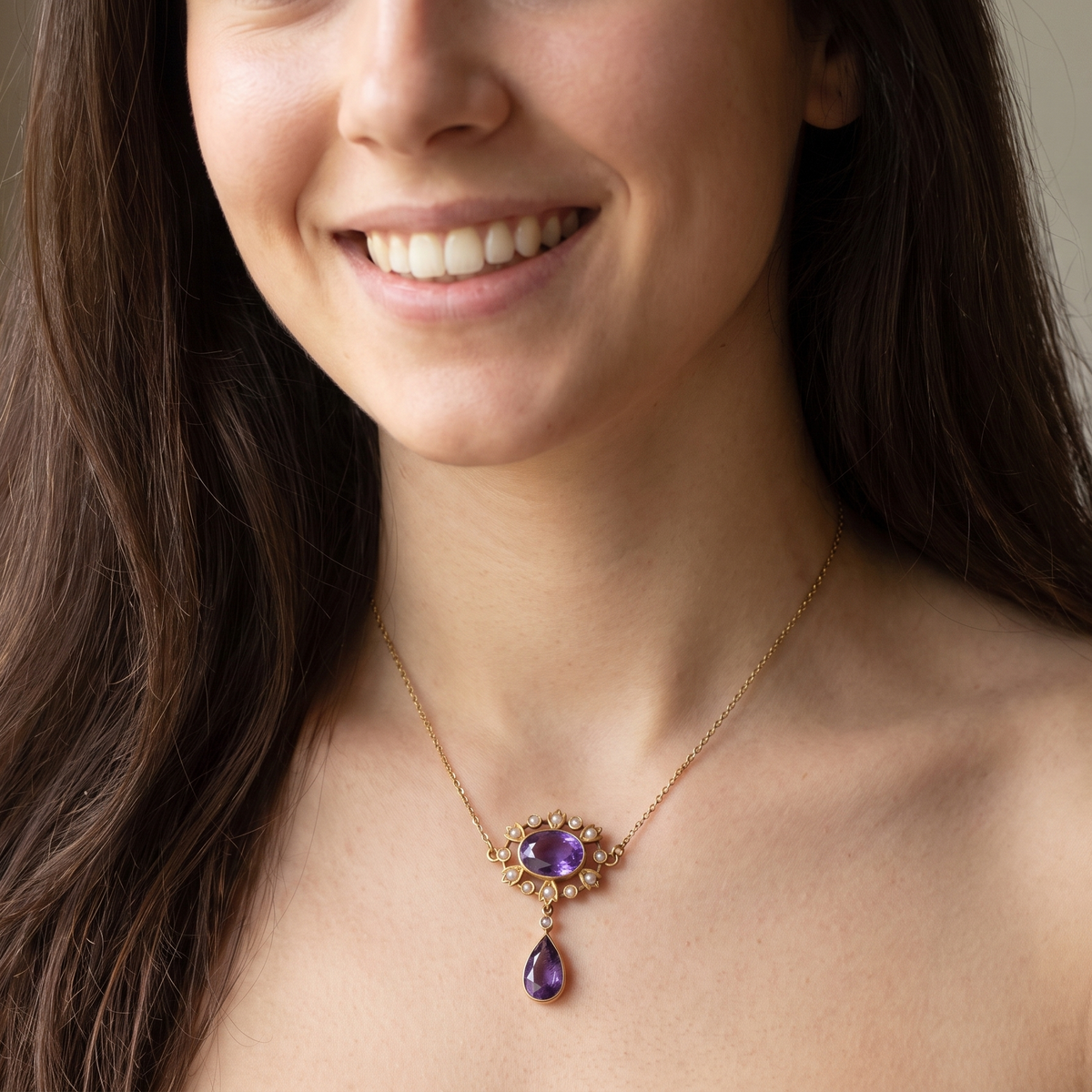 model An elegant pendant from the late part of the 19th century. This Victorian pendant features two luxurious amethyst gemstones,