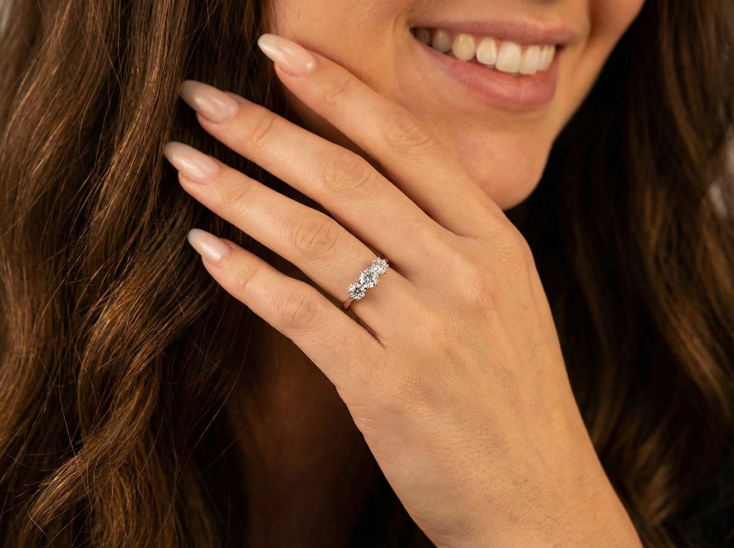 model An ever-popular trilogy three-stone diamond ring, this beautiful example is in near-new condition