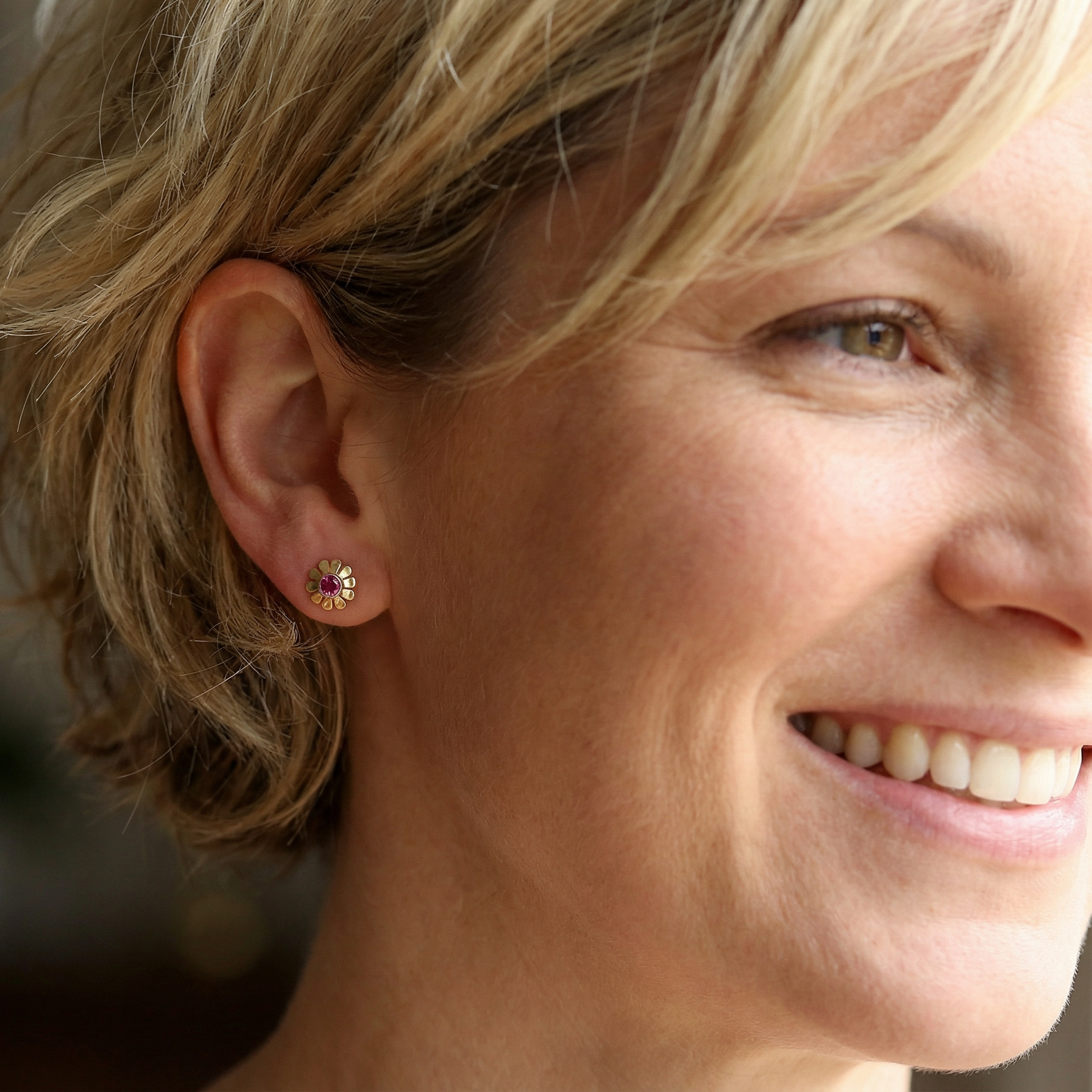 model An exceptional pair of ruby earrings.Each earring is centred with a cushion-shaped ruby measuring approximately 3.6–3.8mm,
