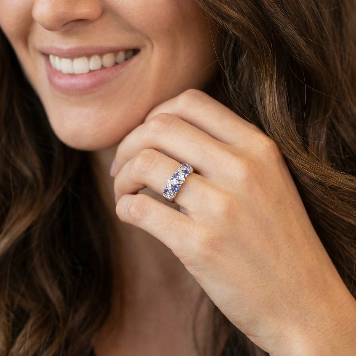 model beautiful and eye-catching dress ring set in 14ct white gold, featuring five triangular tanzanite gemstones