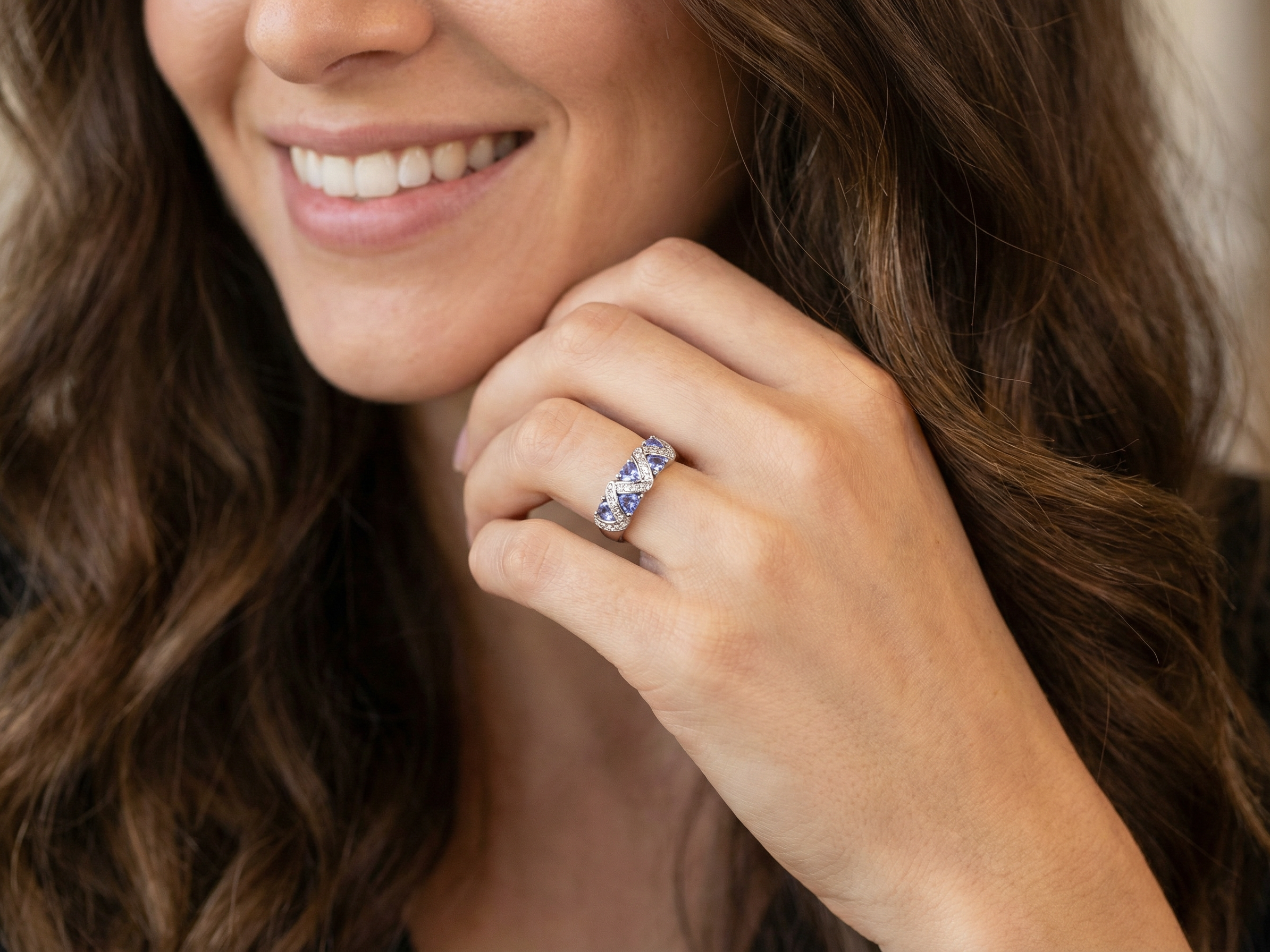 model beautiful and eye-catching dress ring set in 14ct white gold, featuring five triangular tanzanite gemstones