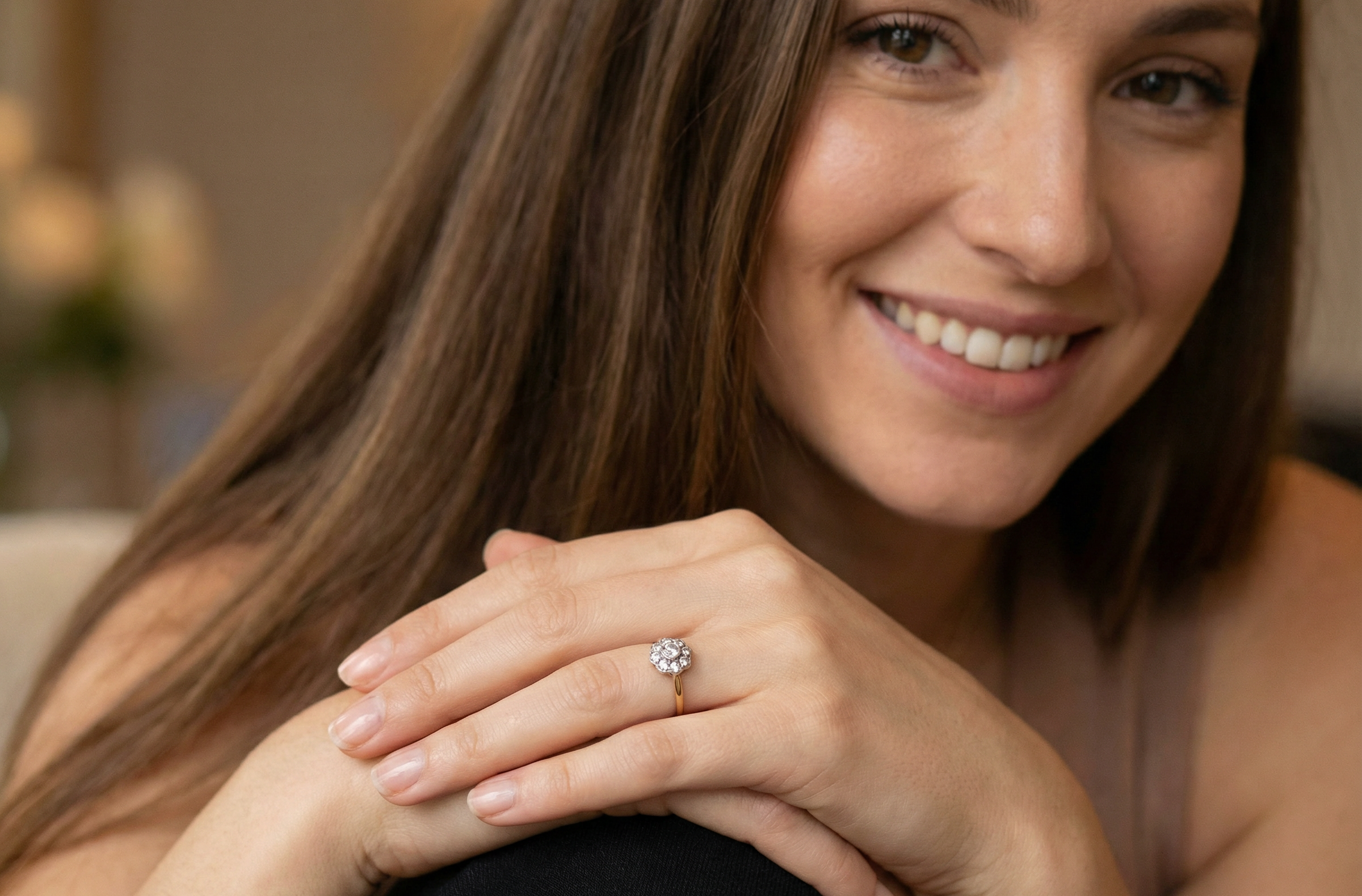 model early 20th-century vintage diamond cluster ring, featuring a classic daisy-shaped head set with nine old brilliant-cut white diamonds.