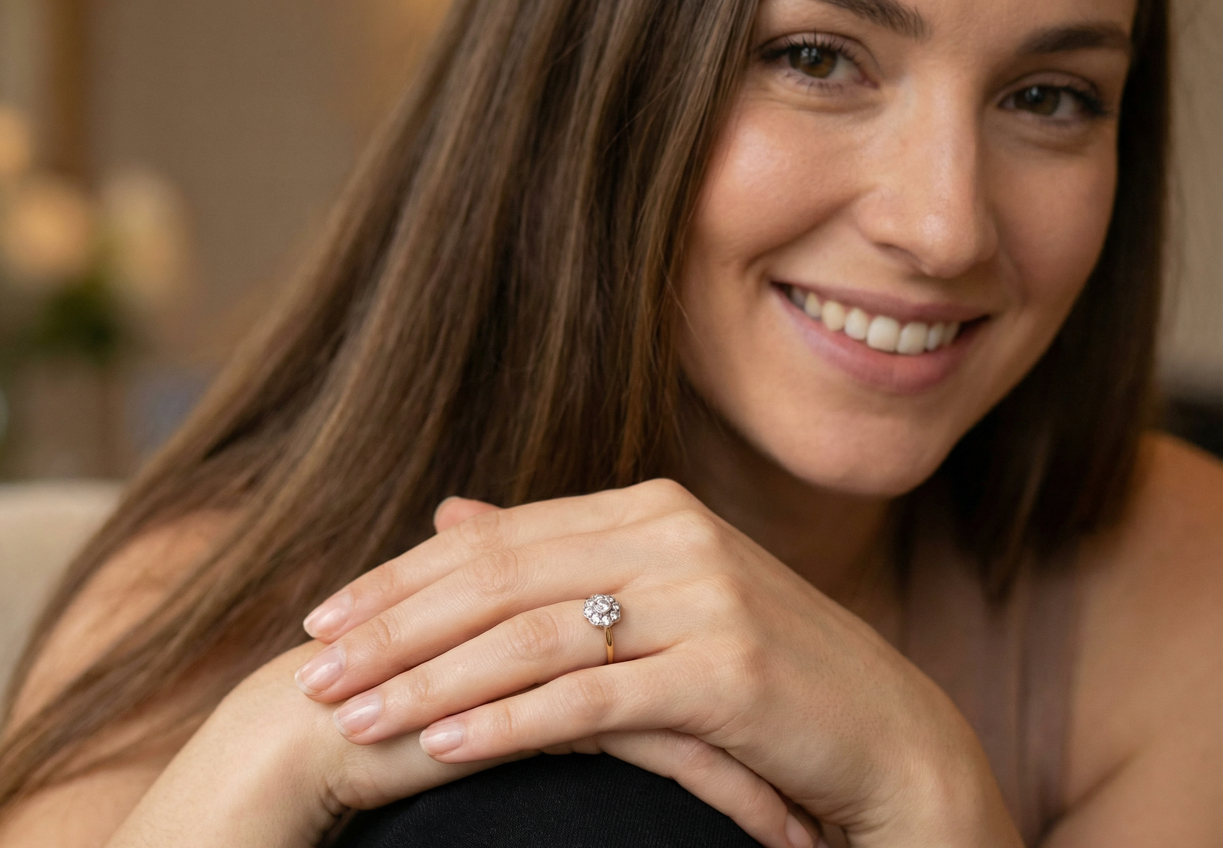 model early 20th-century vintage diamond cluster ring, featuring a classic daisy-shaped head set with nine old brilliant-cut white diamonds.