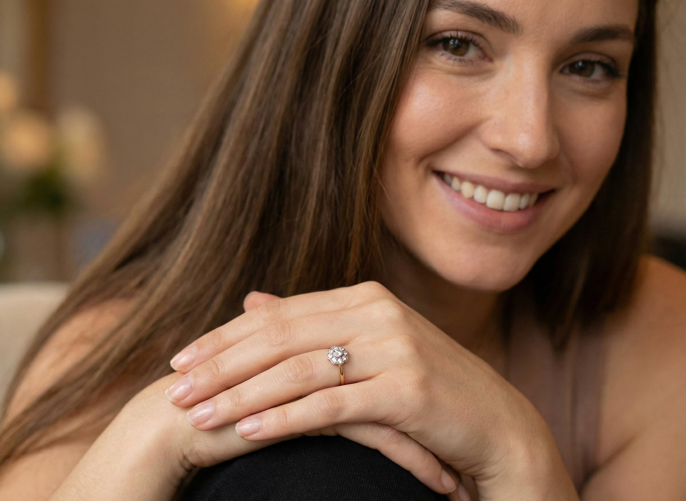 model early 20th-century vintage diamond cluster ring, featuring a classic daisy-shaped head set with nine old brilliant-cut white diamonds.