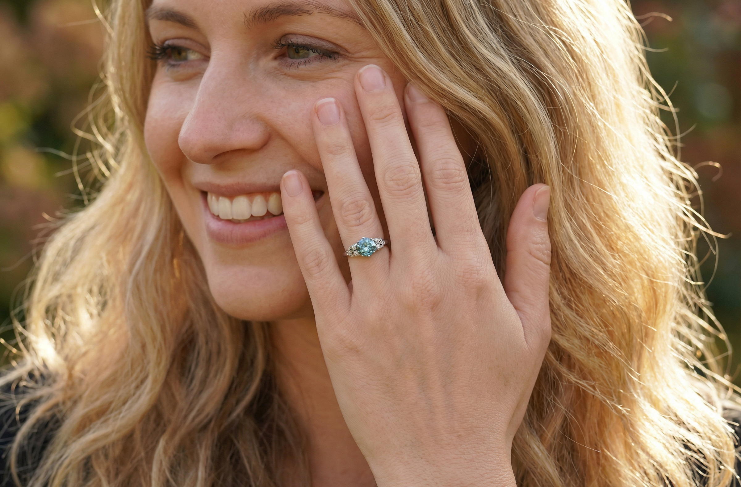 model fine Art Deco ring that features a stunning natural blue zircon centre stone
